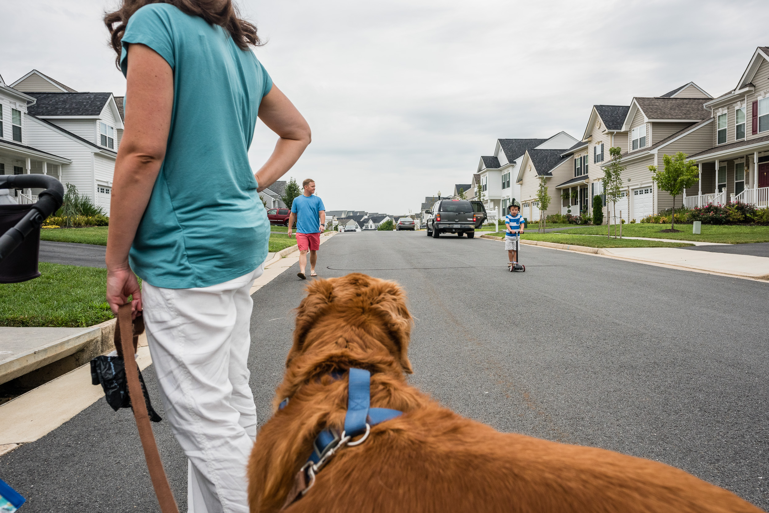 Family taking a walk with dog in NOrthern Virginia by Nicole Sanchez Photography
