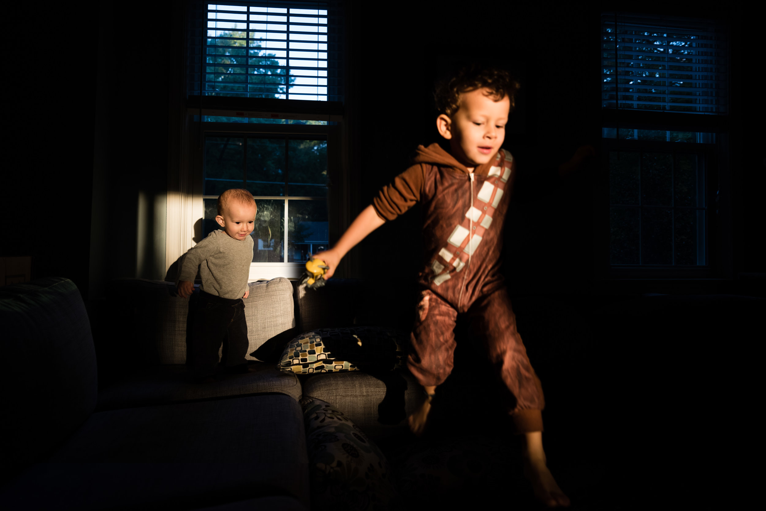 boy dressed as chewbacca jumping on couch by northern virginia family photographer nicole sanchez