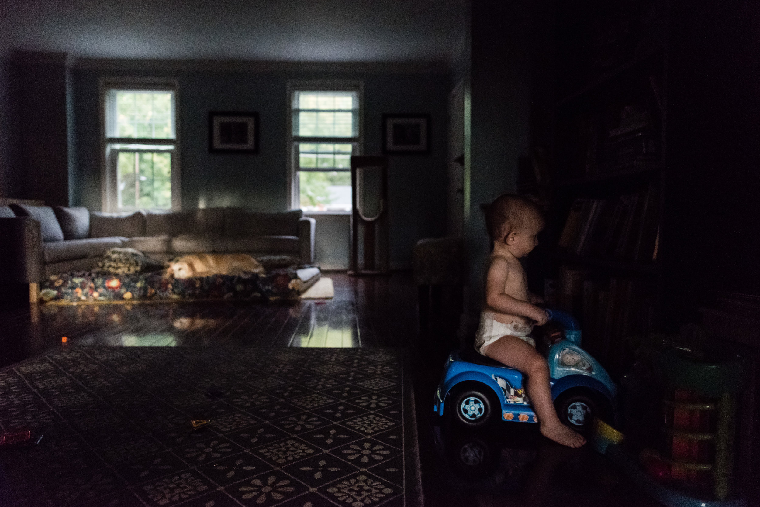 baby riding toy car by northern virginia family photographer nicole sanchez