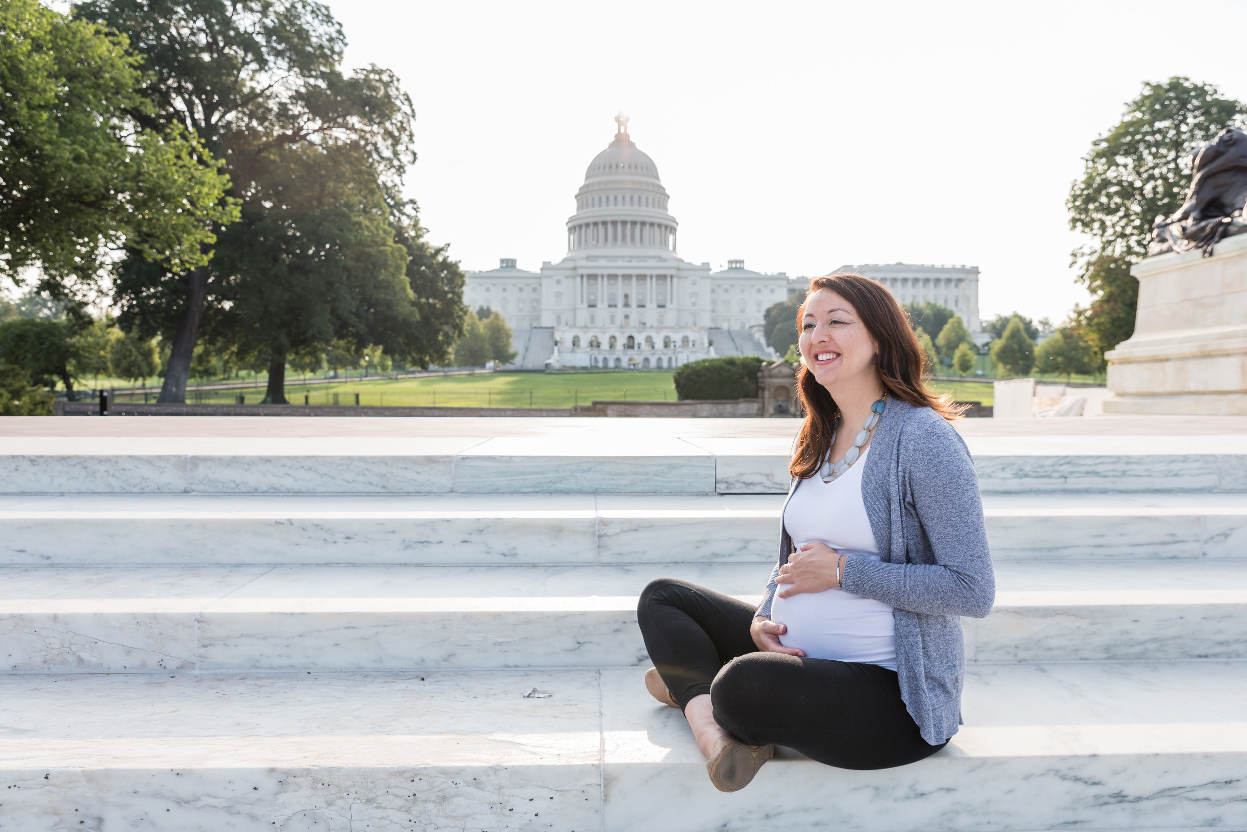 Lifestyle maternity session at U.S. Capitol Building in Washington, DC by Family Photographer Nicole Sanchez