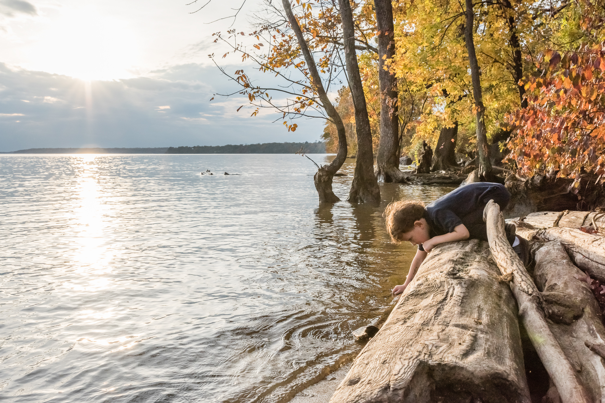 Boy playing in Potomac River by Northern Virginia Family Photographer Nicole Sanchez