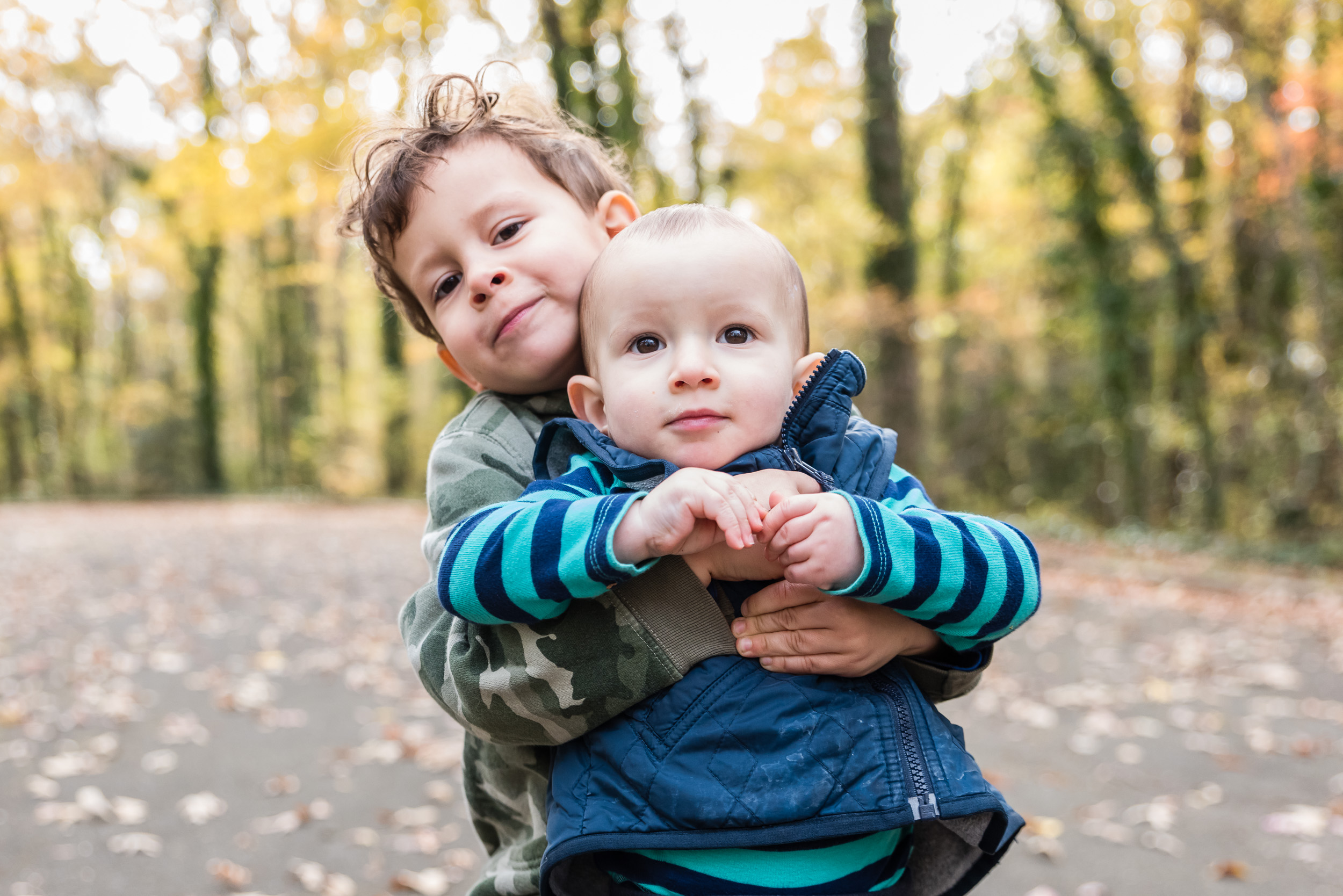 Brothers playing in fall colors by Northern Virginia Family Photographer Nicole Sanchez