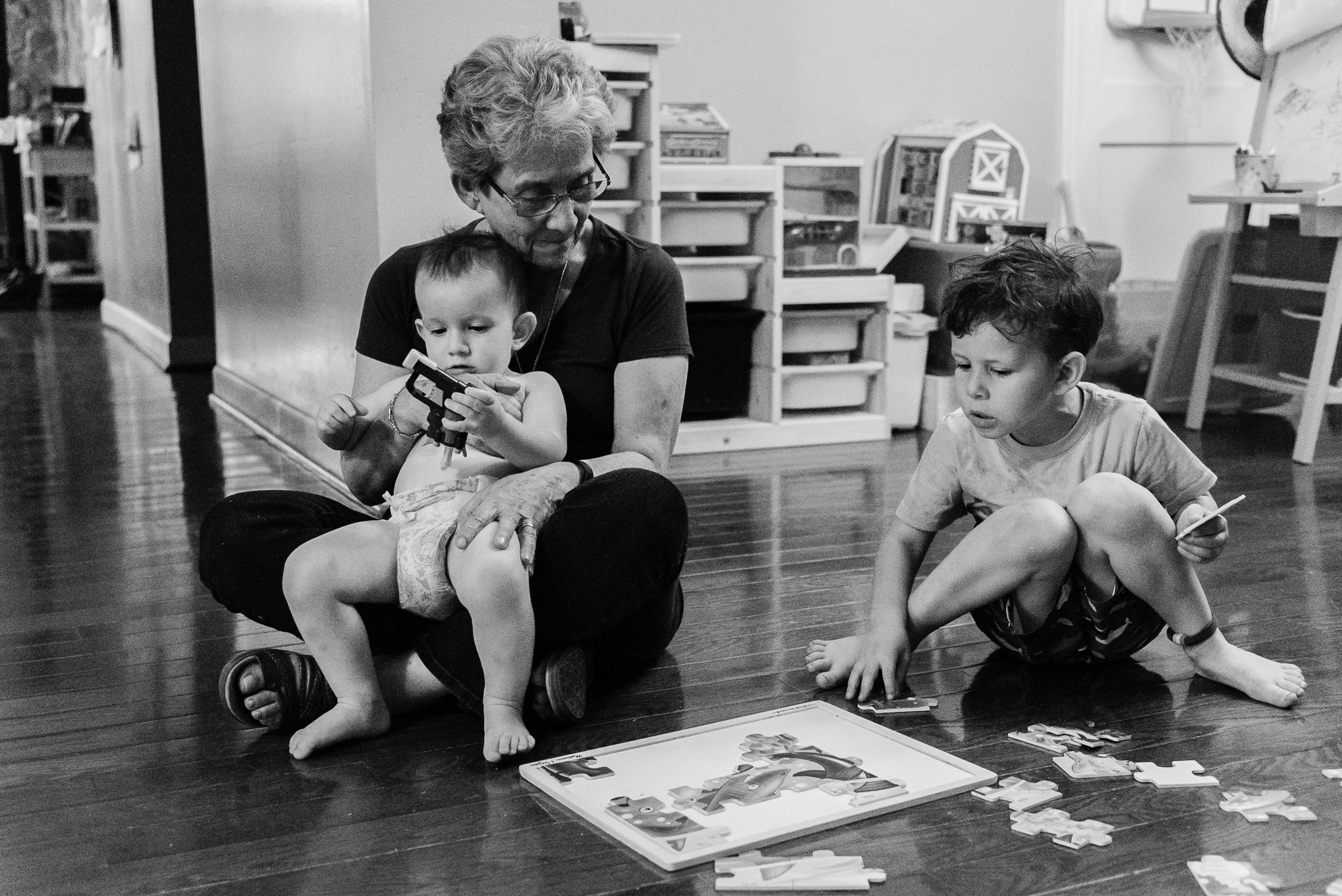 Grandmother playing game with grandsons by Northern Virginia Family Photographer Nicole Sanchez