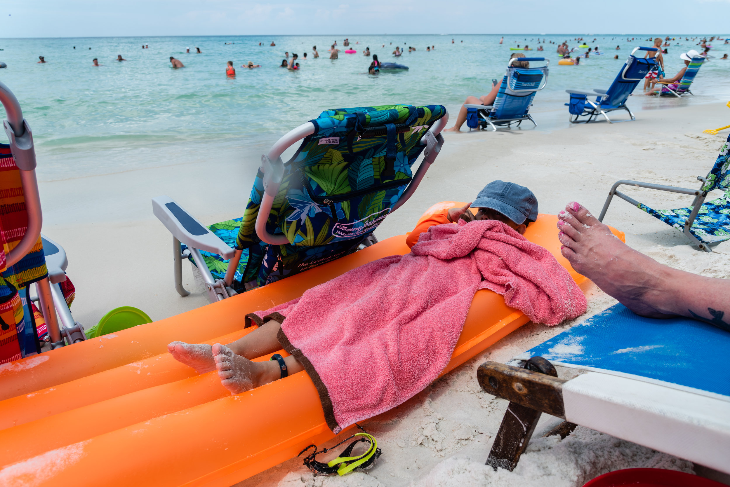 Boy relaxing on beach by Northern Virginia Family Photographer Nicole Sanchez