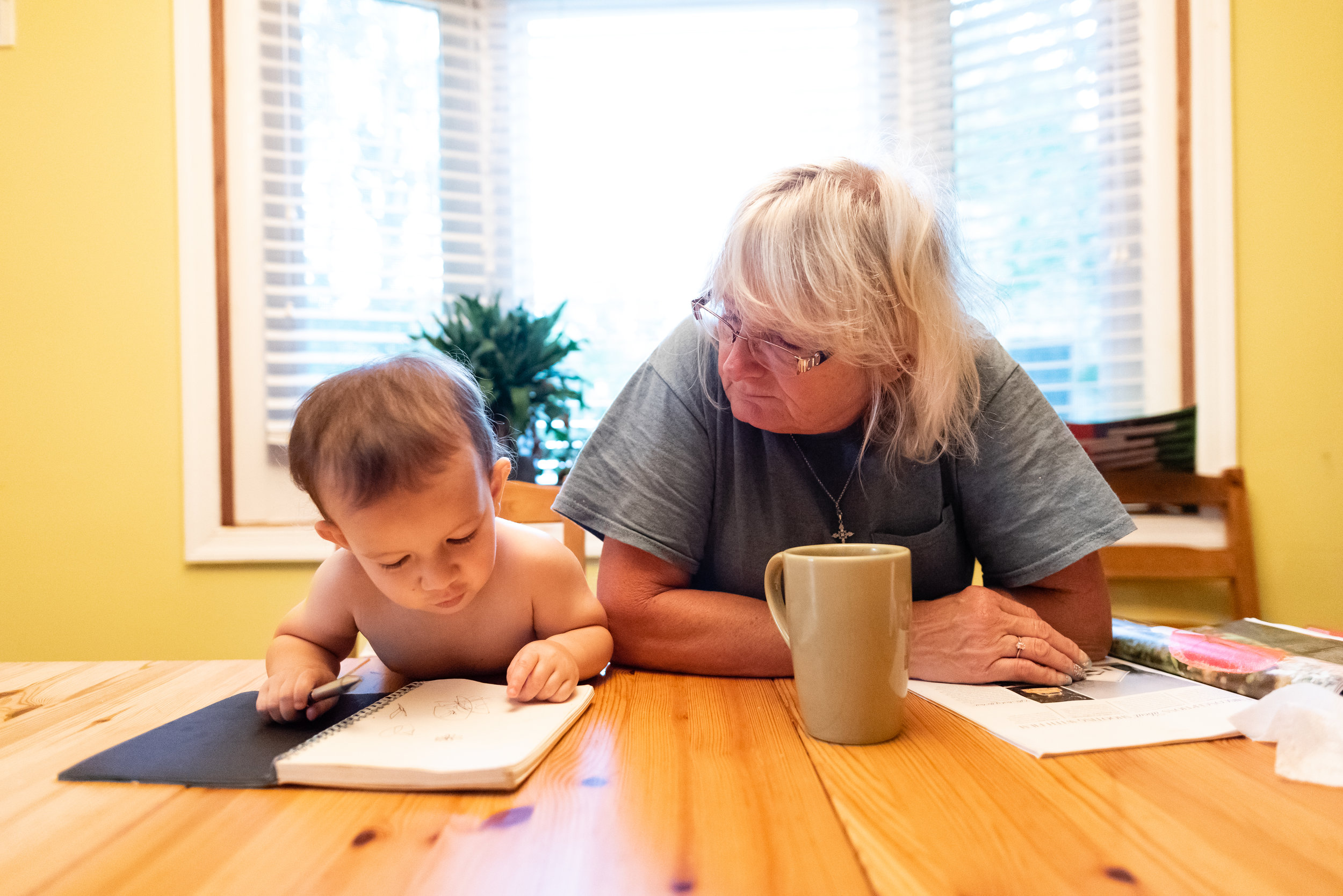 Grandma and toddler enjoying breakfast together by Northern Virginia Family Photographer Nicole Sanchez