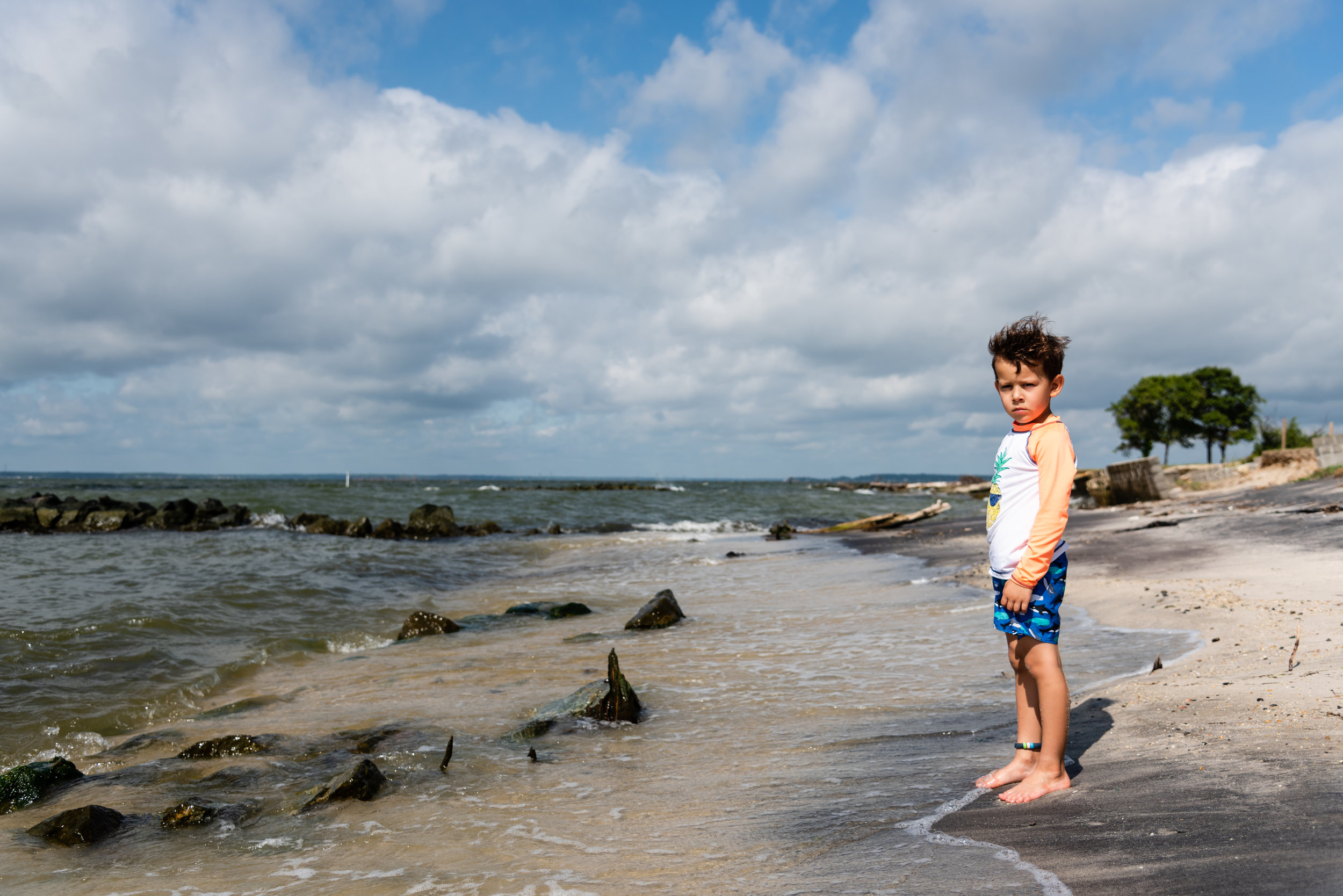 Boy on beach by Northern Virginia Family Photographer Nicole Sanchez