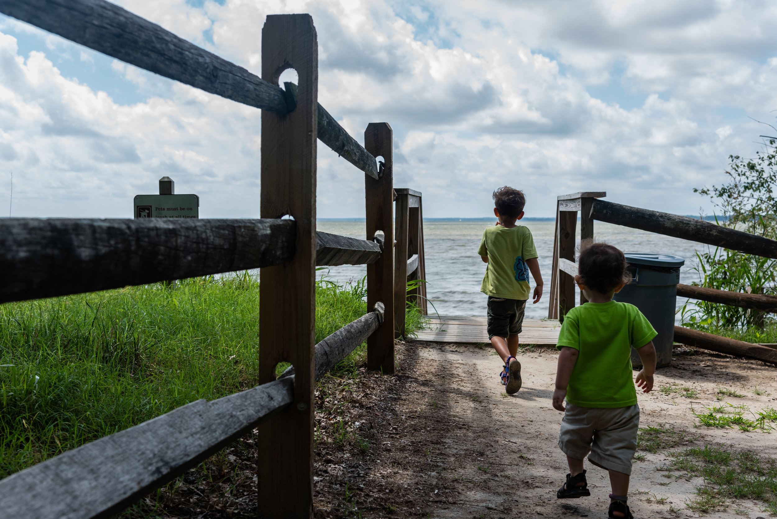 Brothers walking to the beach by Northern Virginia Family Photographer Nicole Sanchez