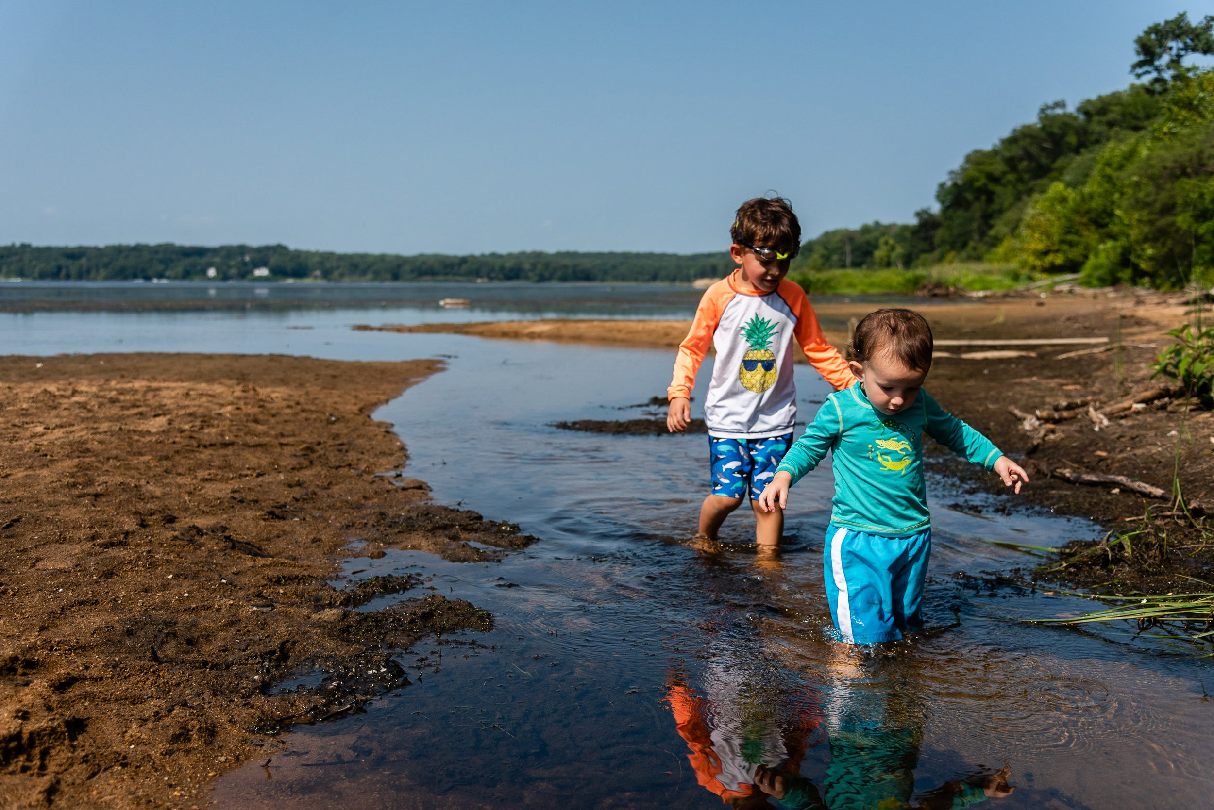 Brothers wading in water at Mason Neck Park by Northern Virginia Family Photographer Nicole Sanchez