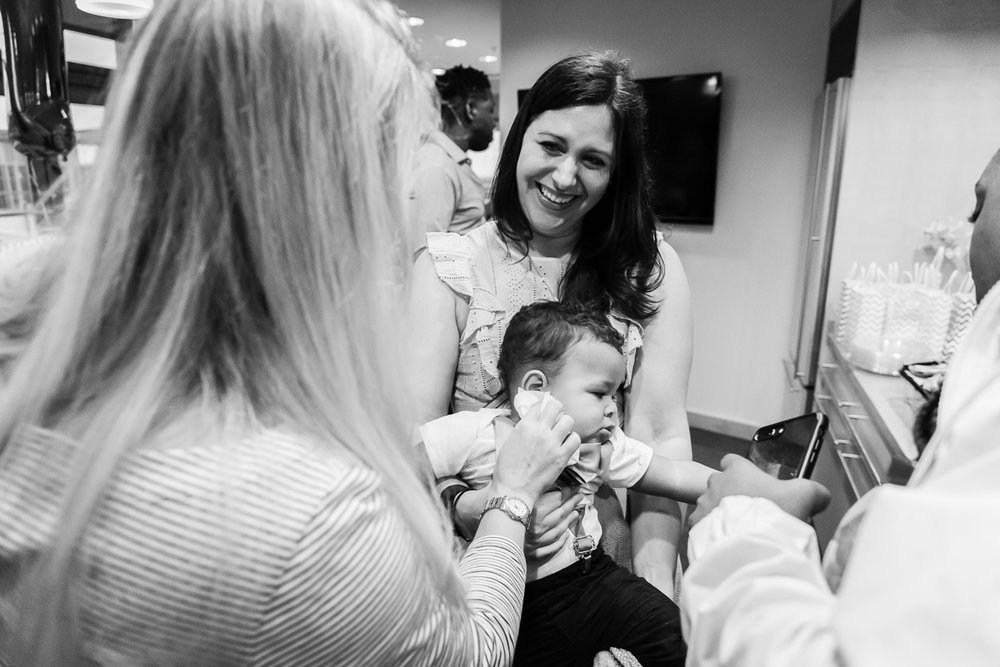 Family helping clean cake off baby by Northern Virginia Photographer Nicole Sanchez