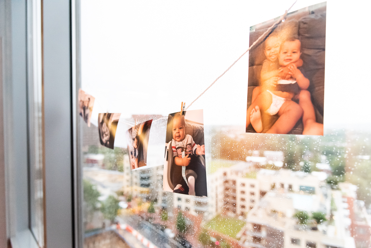 Baby photos as decoration at birthday party by Northern Virginia Family Photographer Nicole Sanchez