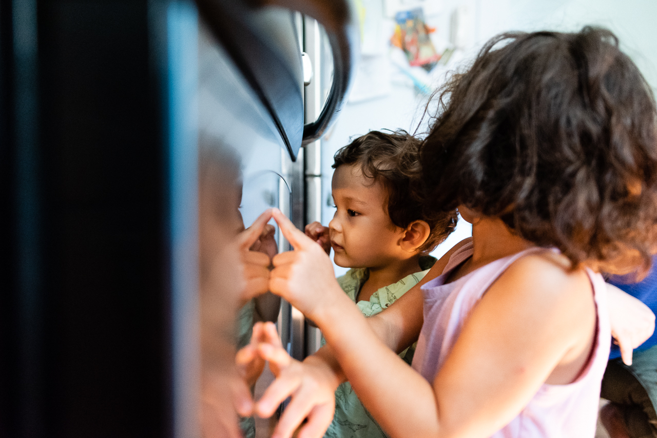 Kids waiting for cookies to come out of oven by Northern Virginia Family Photographer Nicole Sanchez