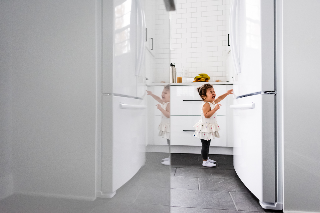 Little girl having a meltdown in kitchen