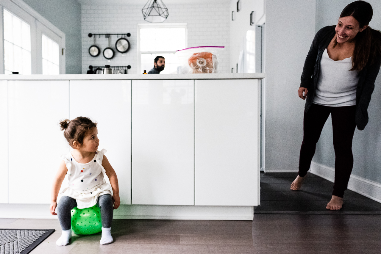 Little girl sitting on ball