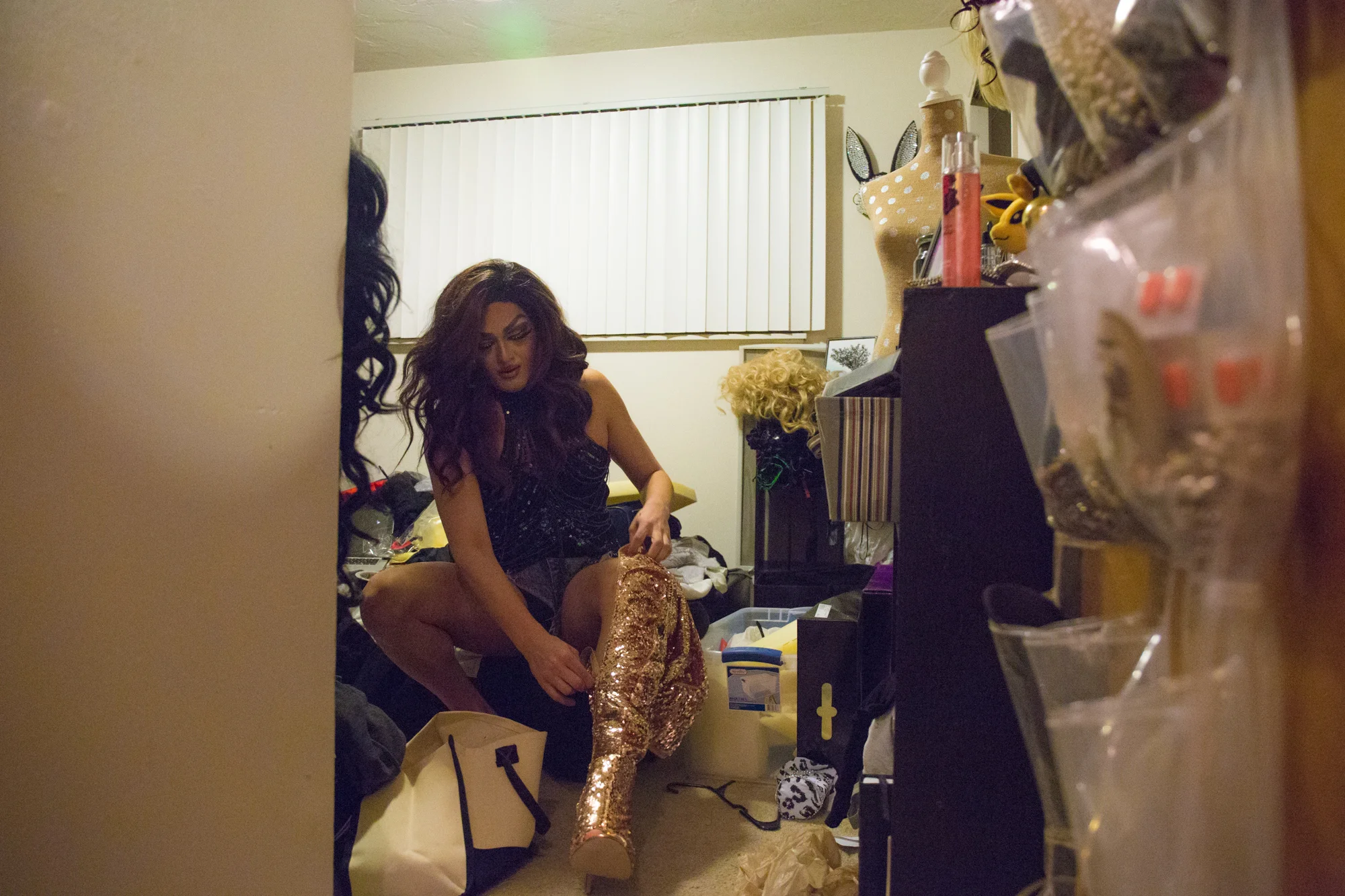  Nicky Serene zips up her second choice of boot before the Glamazons show. Mark lives in a two bedroom apartment by himself, and has an entire room dedicated to drag. His entire house is spotless, exept for the drag room, which is always overflowing 