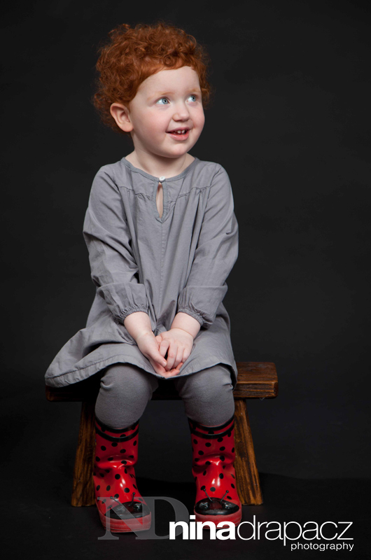 girl's portrait with red boots