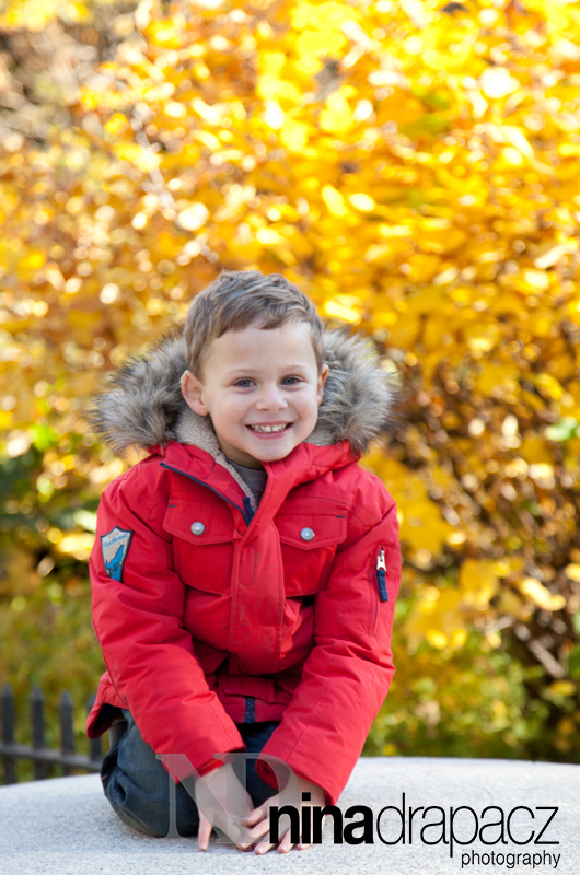 boy in red coat fall photography