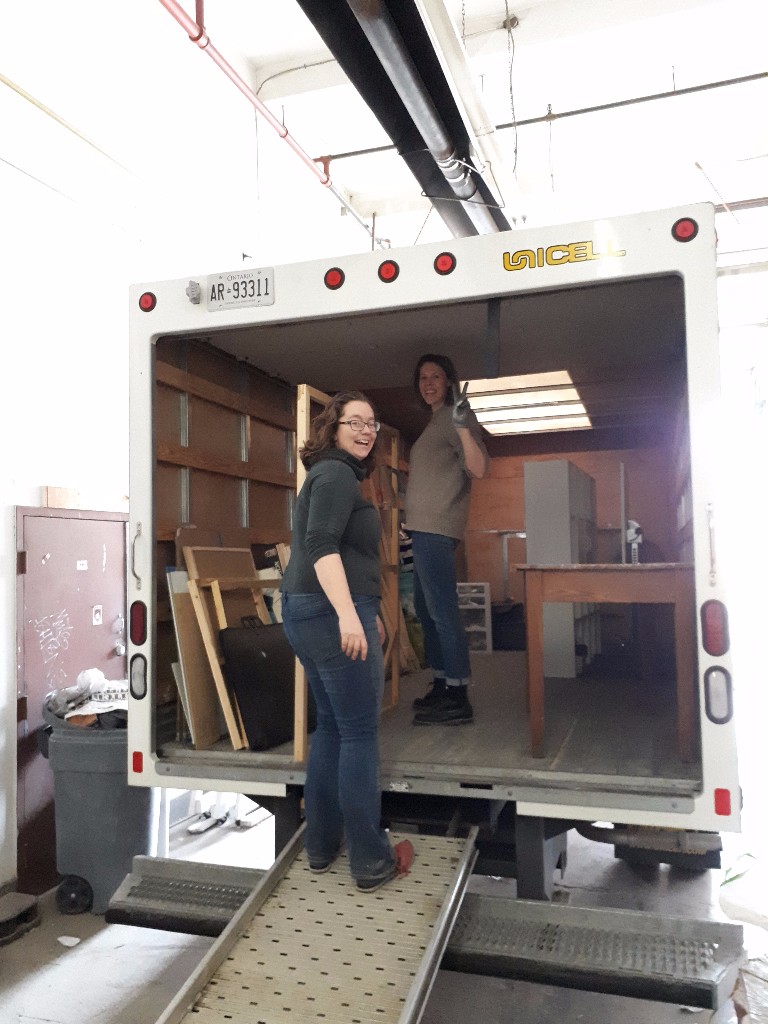 Akin artists Rebekah Andrade and Verity Griscti help load their studio supplies into Akin's moving trucks!