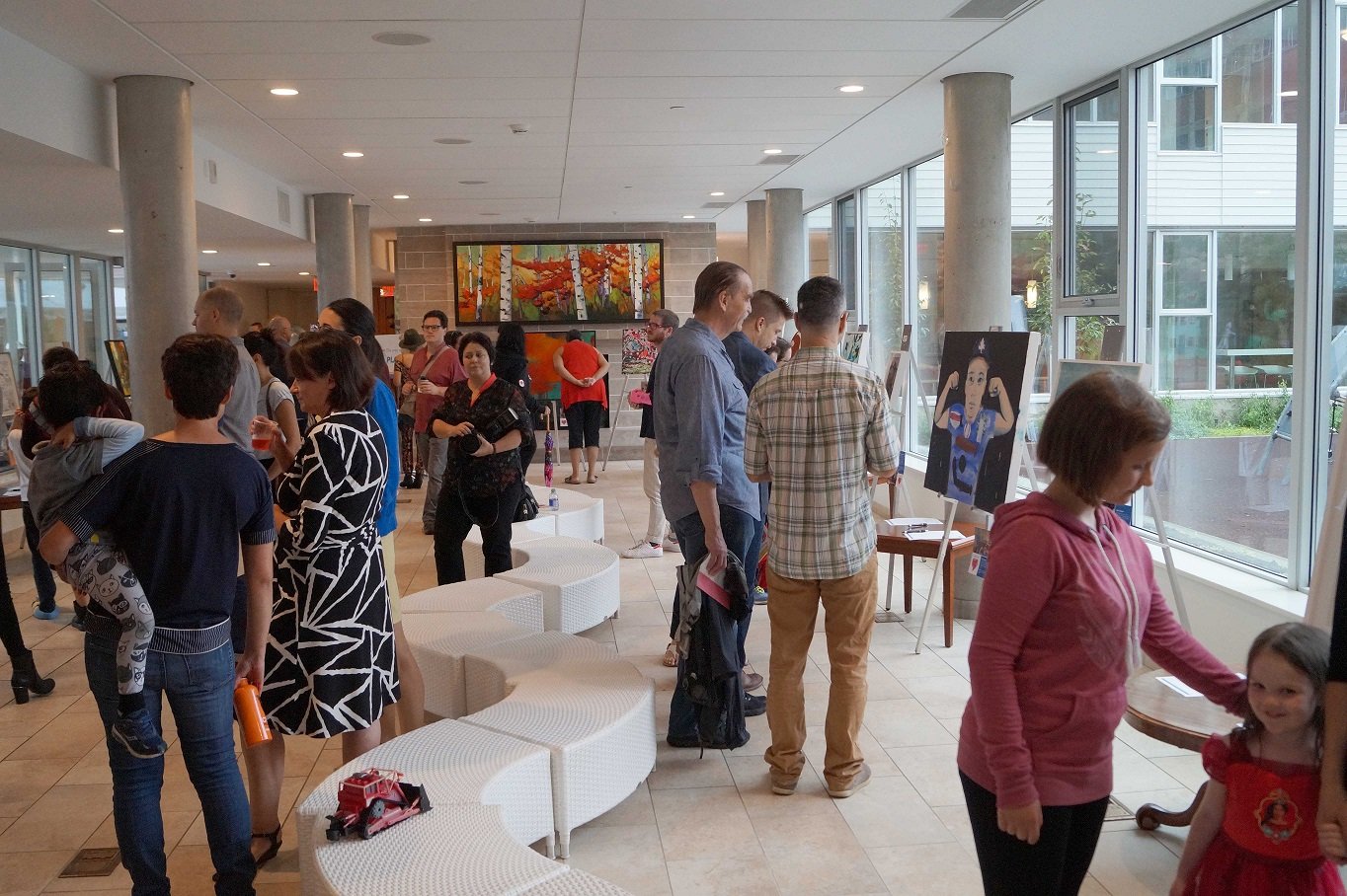 2015 - Guests enjoy the artwork at the the exhibition day of the Art of Healing, a fundraiser art collaboration with the Ronald MacDonald House