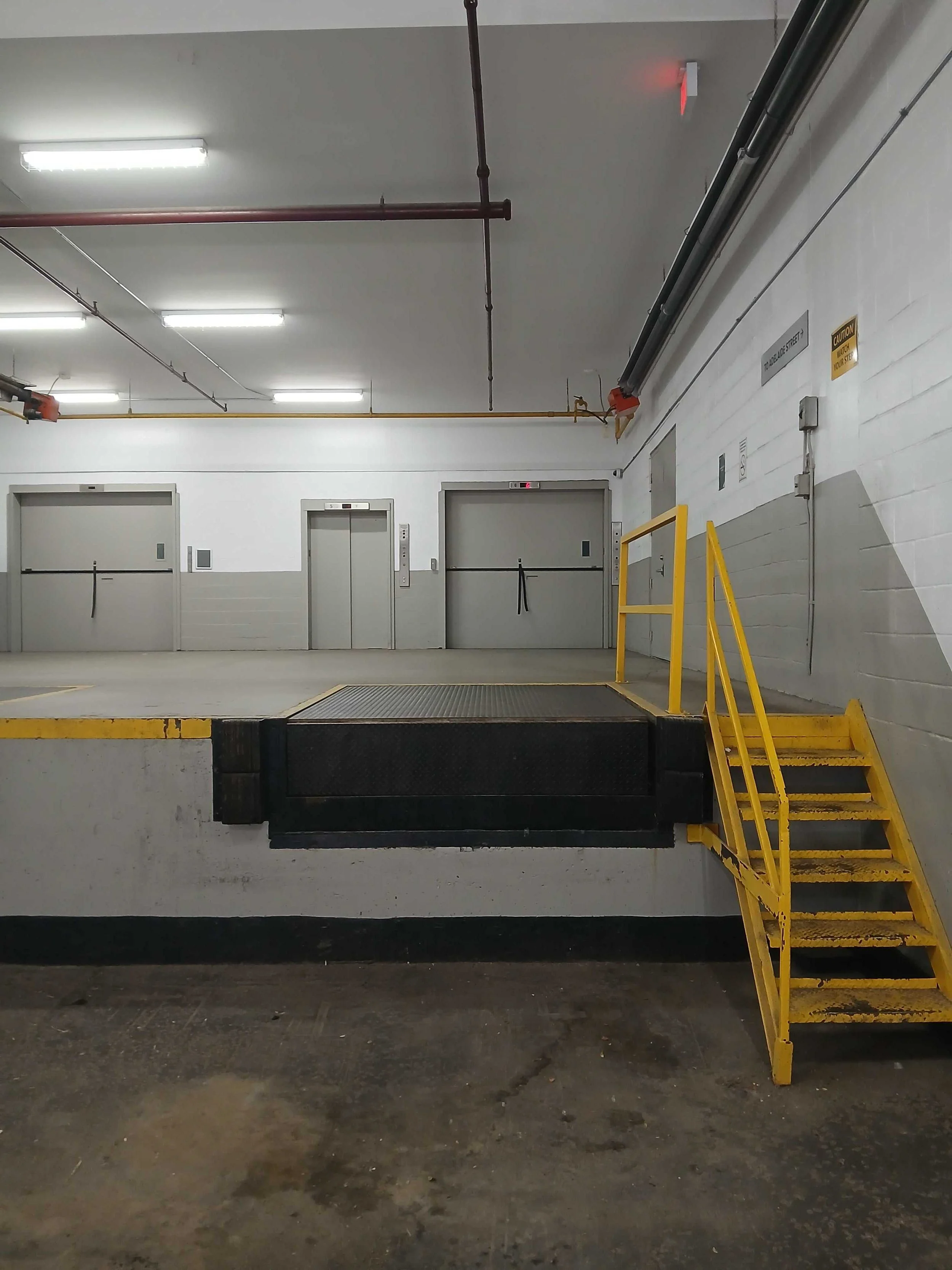 Rear loading bay steps