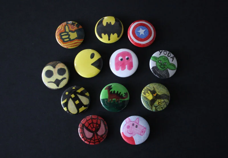 Some hand drawn badges from a family fun day