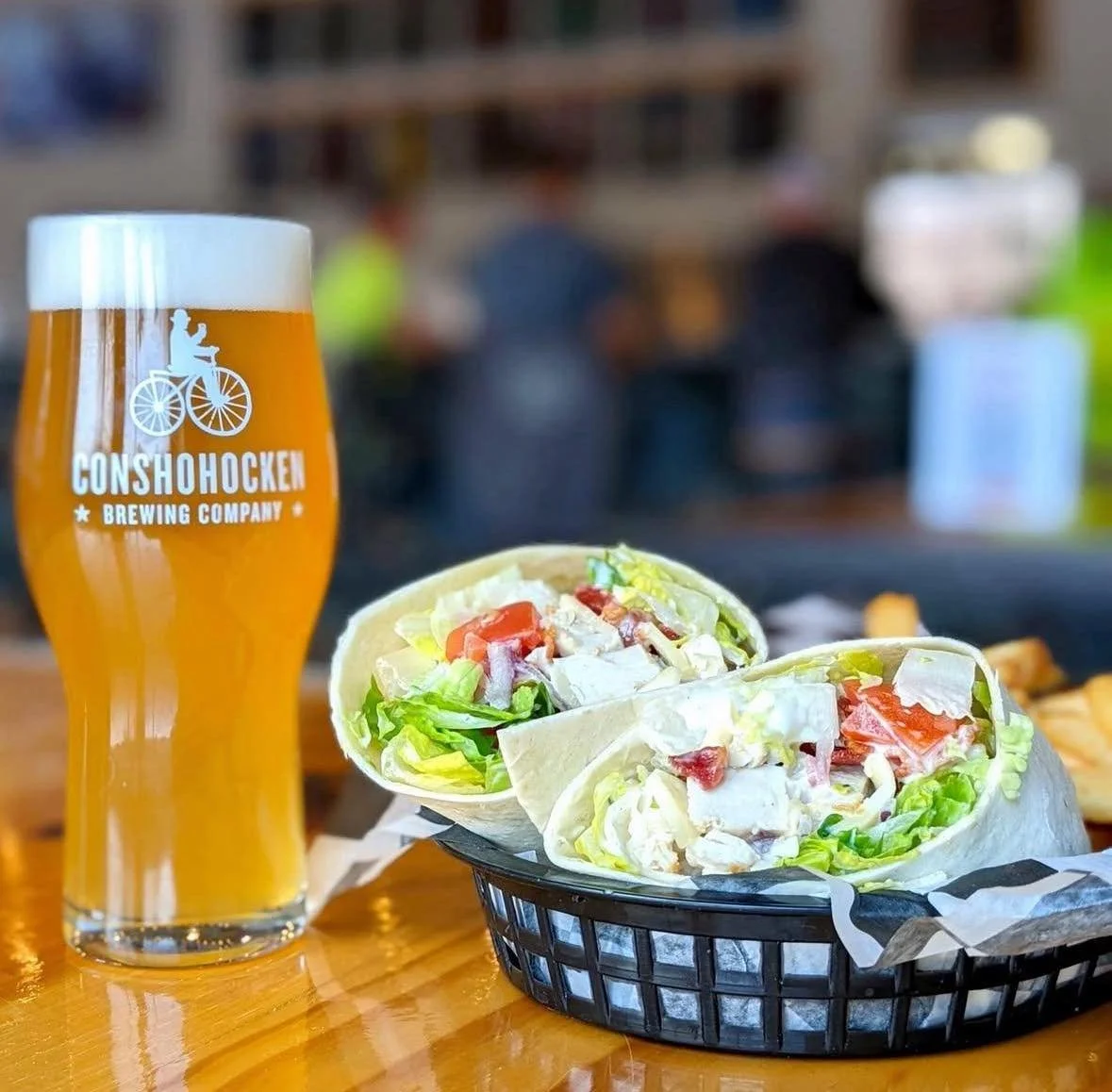 Our Chicken, Ranch &amp; Pork Belly wrap brings all the flavor&mdash;grilled chicken, ranch, and pork belly wrapped up with provolone, lettuce, and tomatoes. Paired here with a cold Backpack Beer. Stop in for lunch! 🍻
