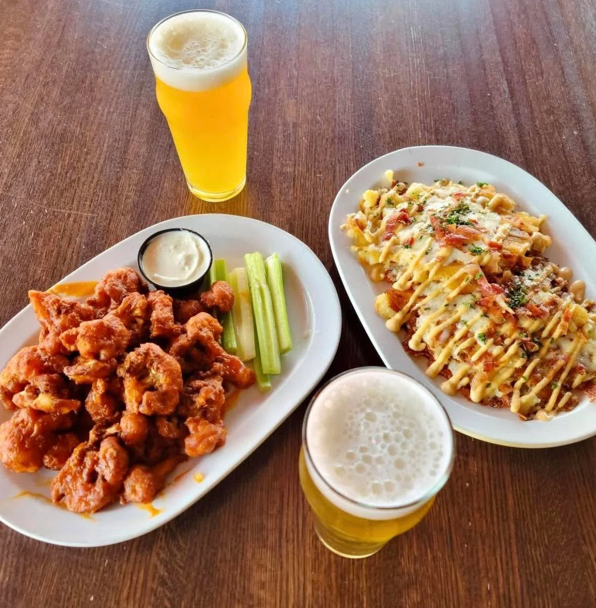 Crispy smashed potatoes loaded with cheddar and bacon, plus buffalo cauliflower with a little kick.

Sounds like a pretty solid way to end the workday 🙌🍻