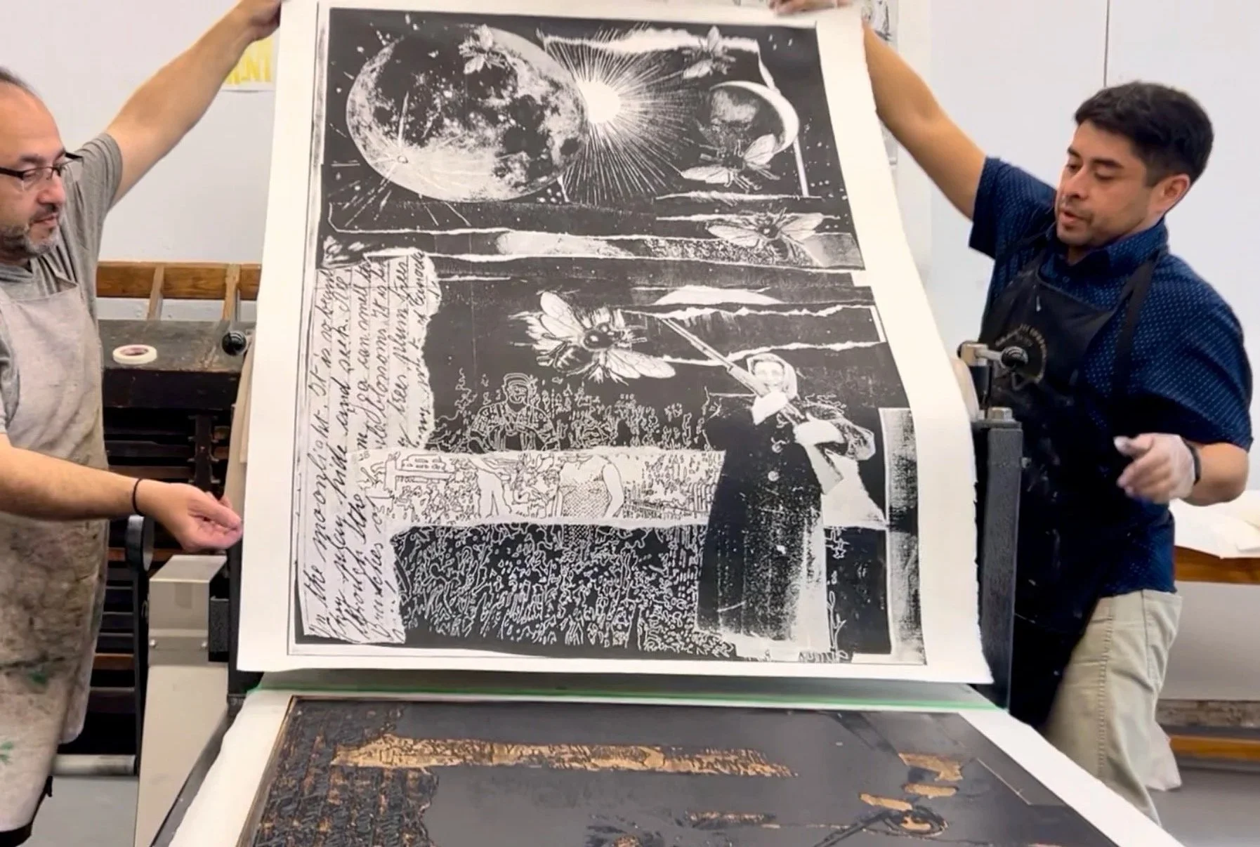  Collaboratively pulling the large format print. 