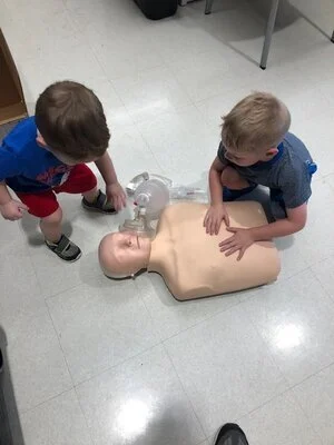 Boys doing CPR.jpg