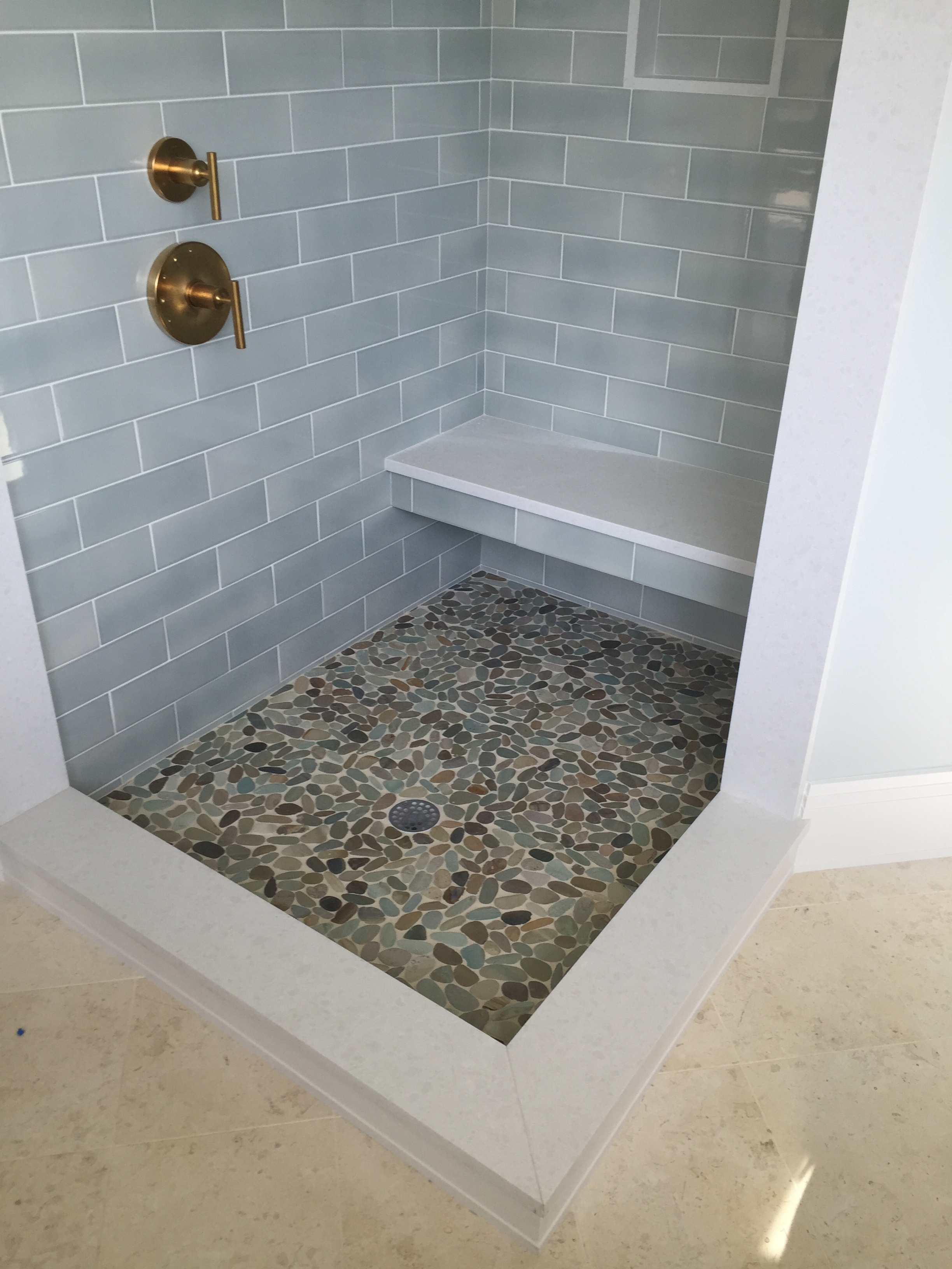 Subway tile with Pebble floor