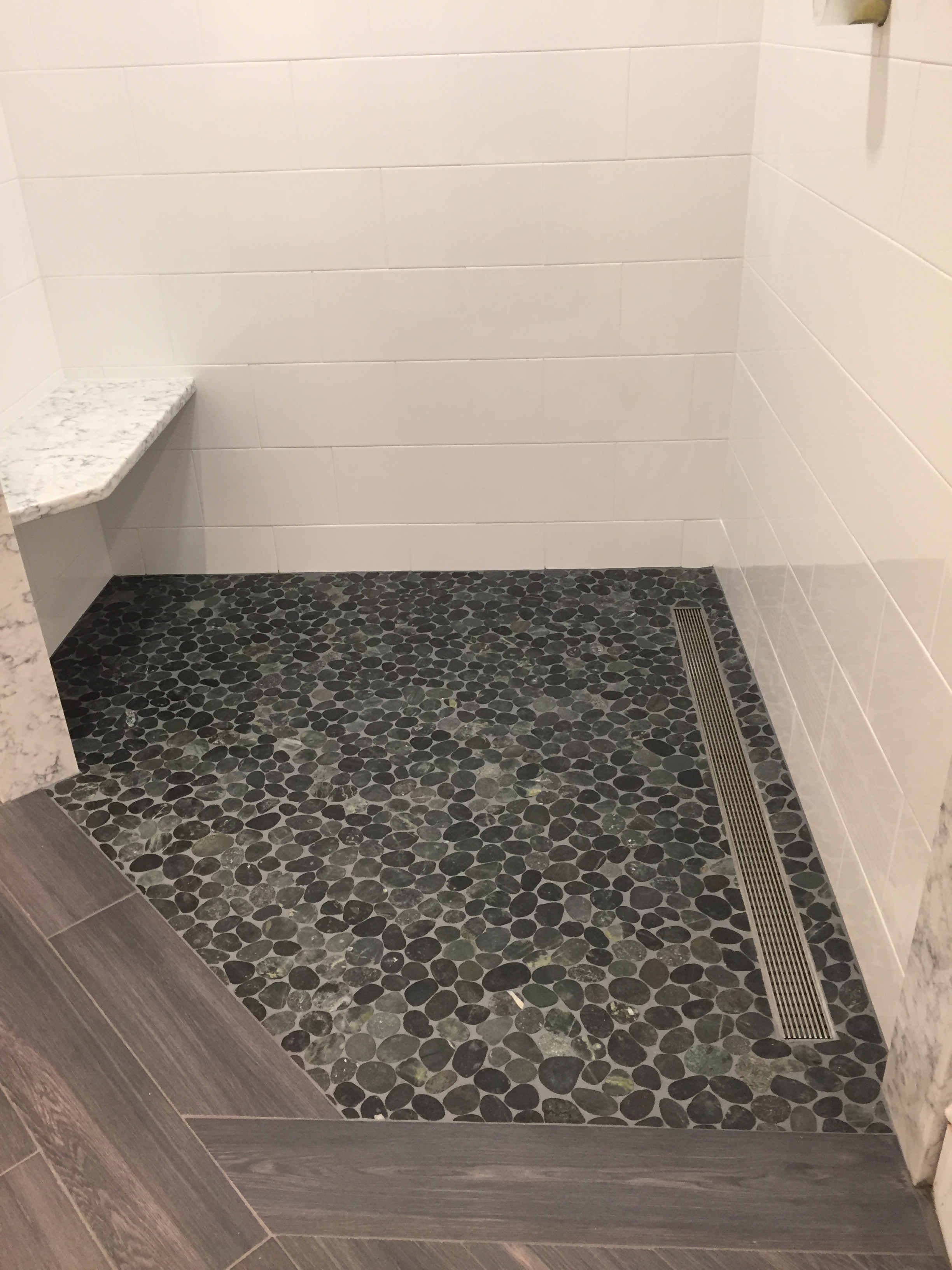 Plank Tile with Pebble Shower Floor