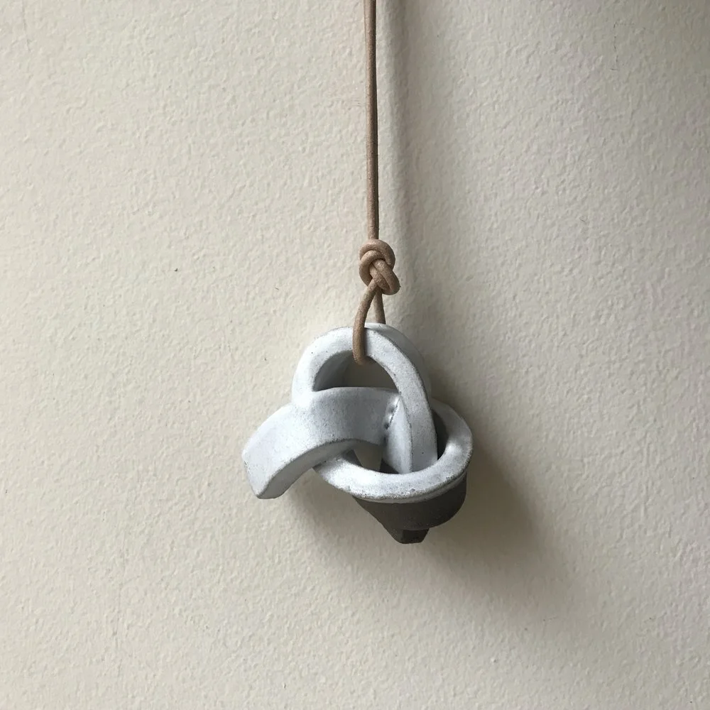 UNION KNOT | SALT ON FOSS ceramic knot on leather cord approx. 2.5"L, 4.5"H, 2"W (varies) $25 Wholesale | $50 Retail