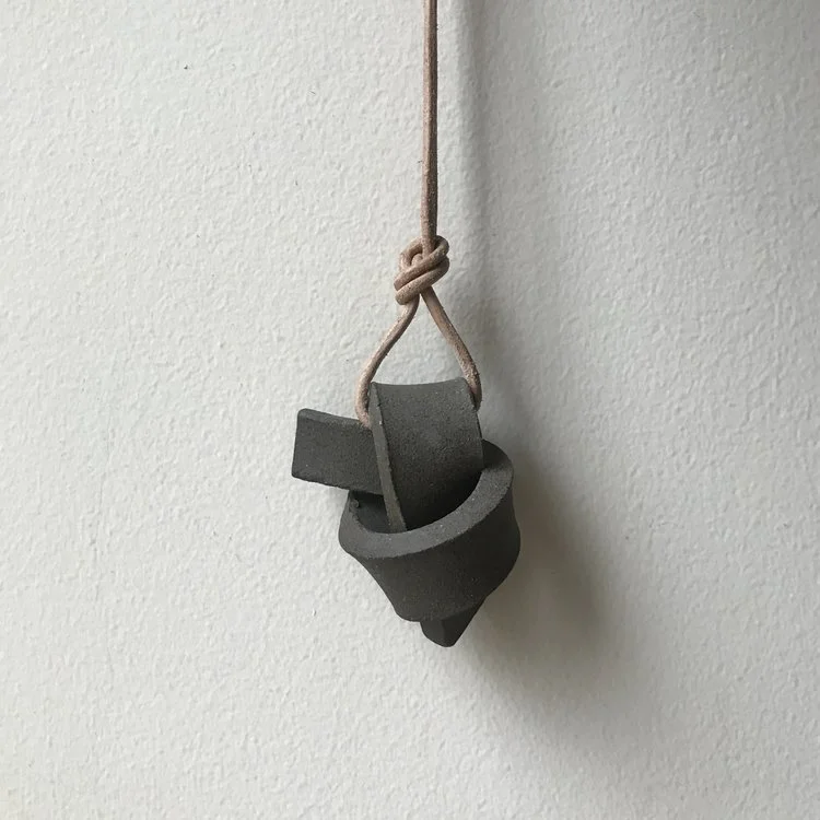 UNION KNOT | FOSS ceramic knot on leather cord approx. 2.5"L, 4.5"H, 2"W (varies) $25 Wholesale | $50 Retail