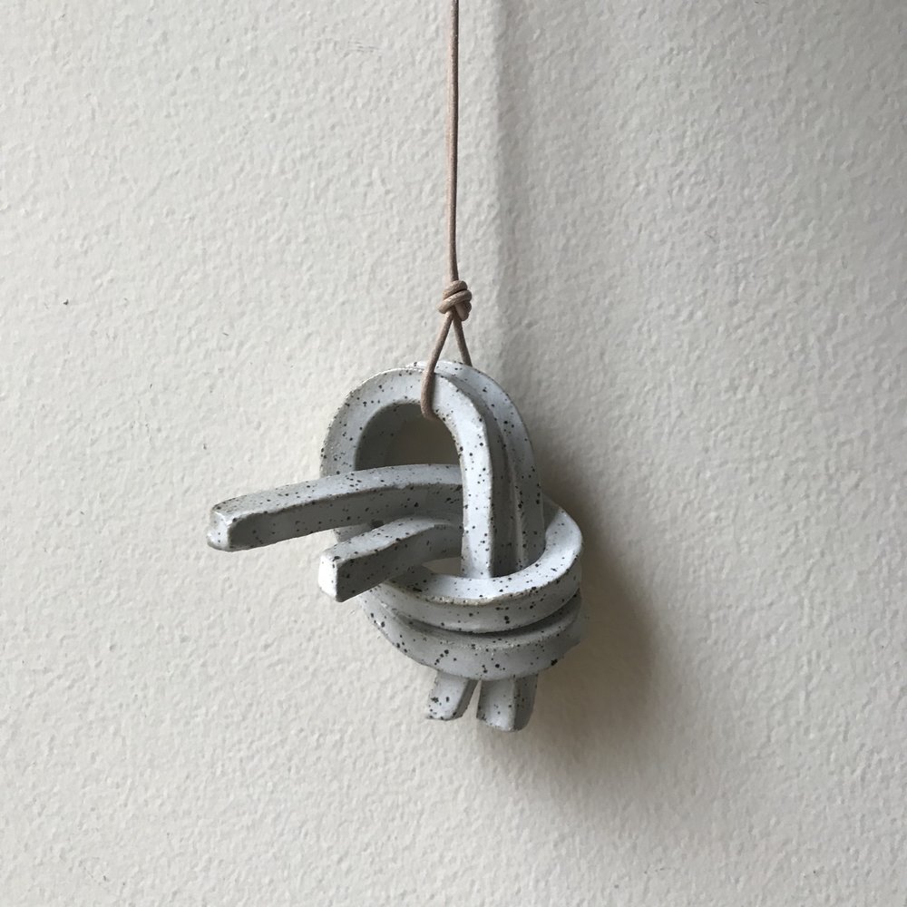 DOUBLE UNION KNOT | CANYON ceramic knot on leather cord approx. 2.5"L, 4.5"H, 2"W (varies) $30 Wholesale | $60 Retail
