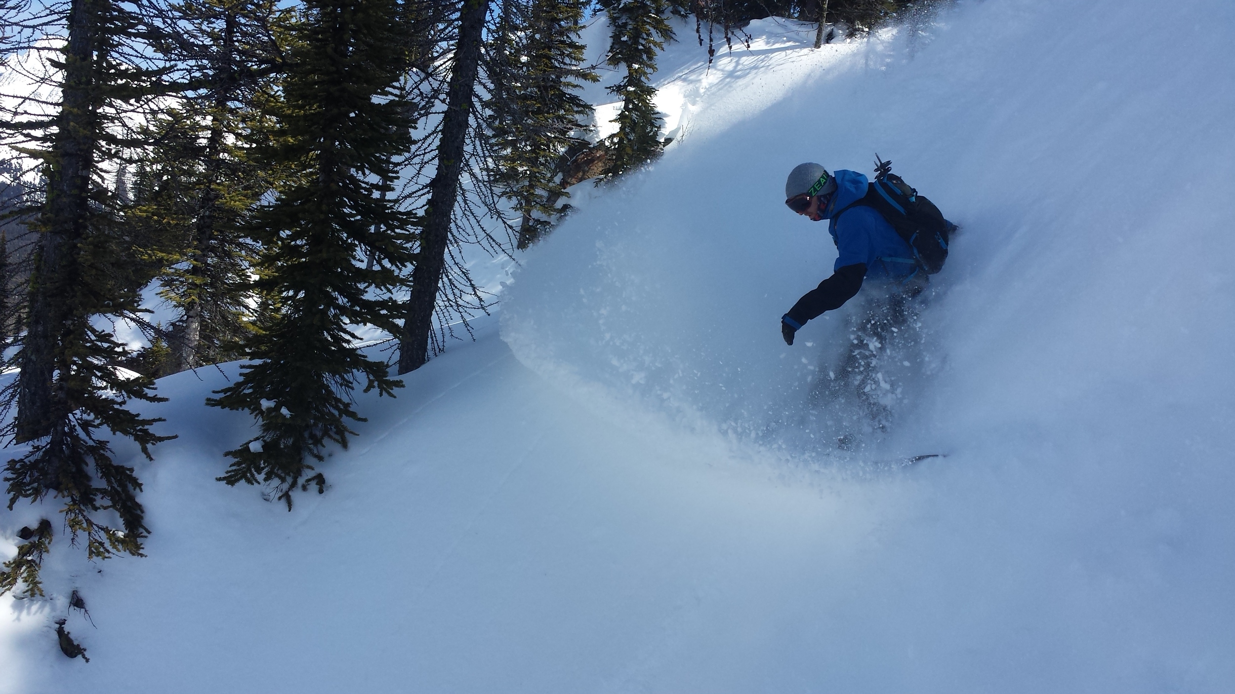 Zach slashing his way into the couloir near Tryst Lake in Kananaskis Country. Photo: Brian