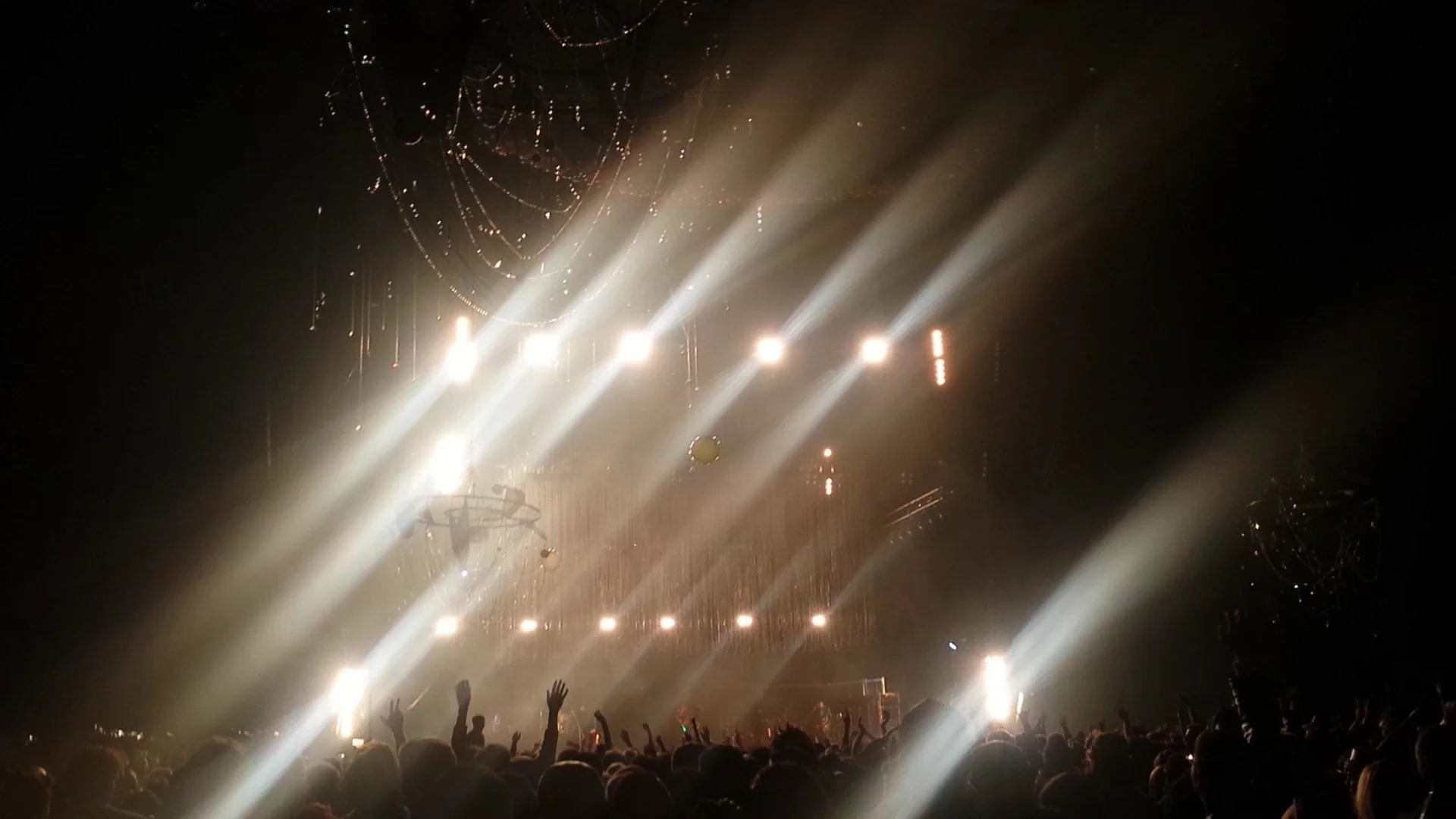 Four chandeliers, 8' across, hanging in Bill Graham Auditorium for New Years Eve 2015. BigOne with Flaming Lips, Ratatat, Tycho, etc. Collaboration with Chrystie Cappelli & Sydney Forester Steel, bailing wire, crystal, fabric, beads