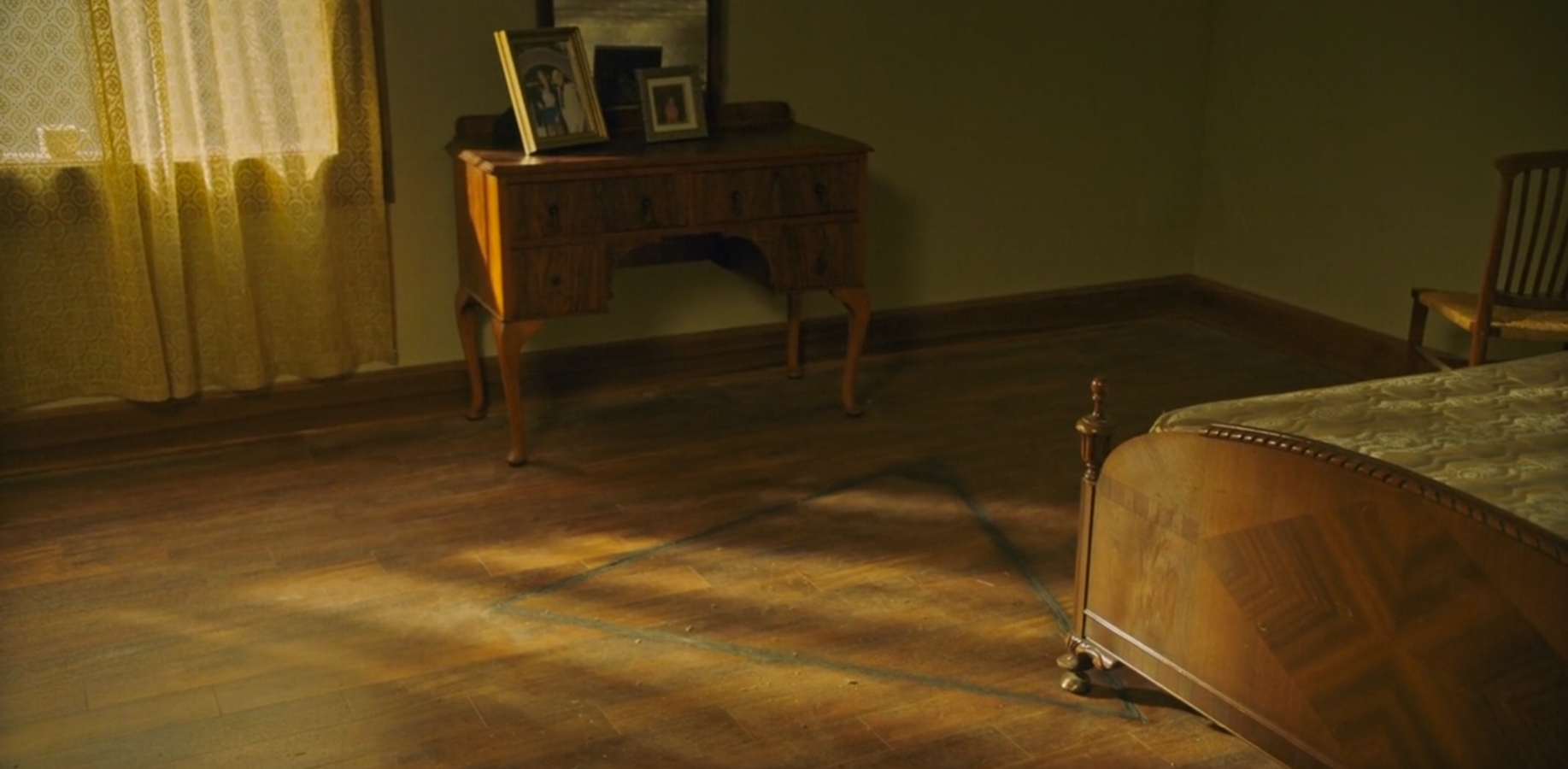 A triangle is carved into the wooden floor