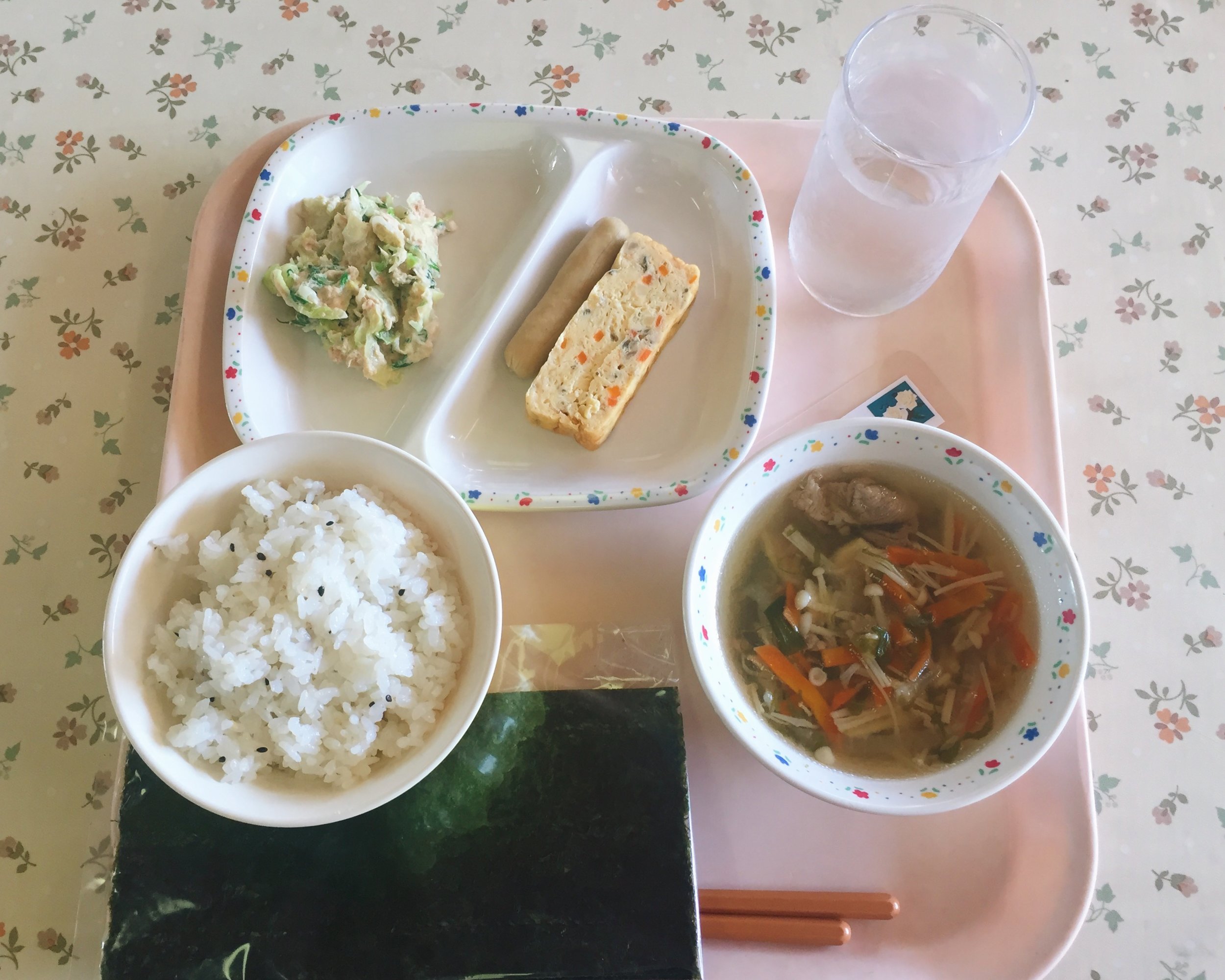 Tuna salad, chicken wiener, rolled omelet, pork and vegetable soup, sushi rice, and nori for making hand rolled sushi