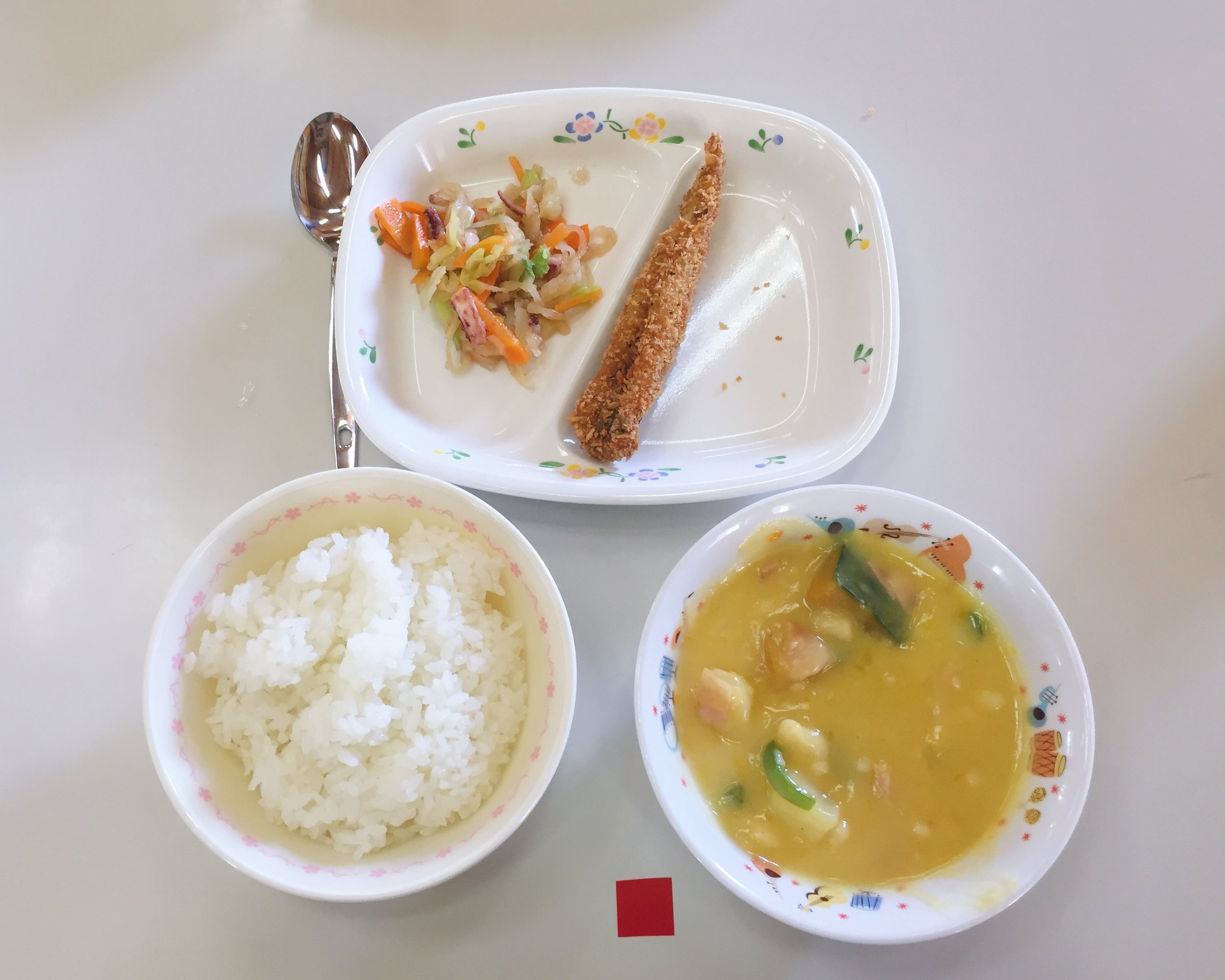 Breaded fried fish, squid salad, soy milk pumpkin stew, and white rice
