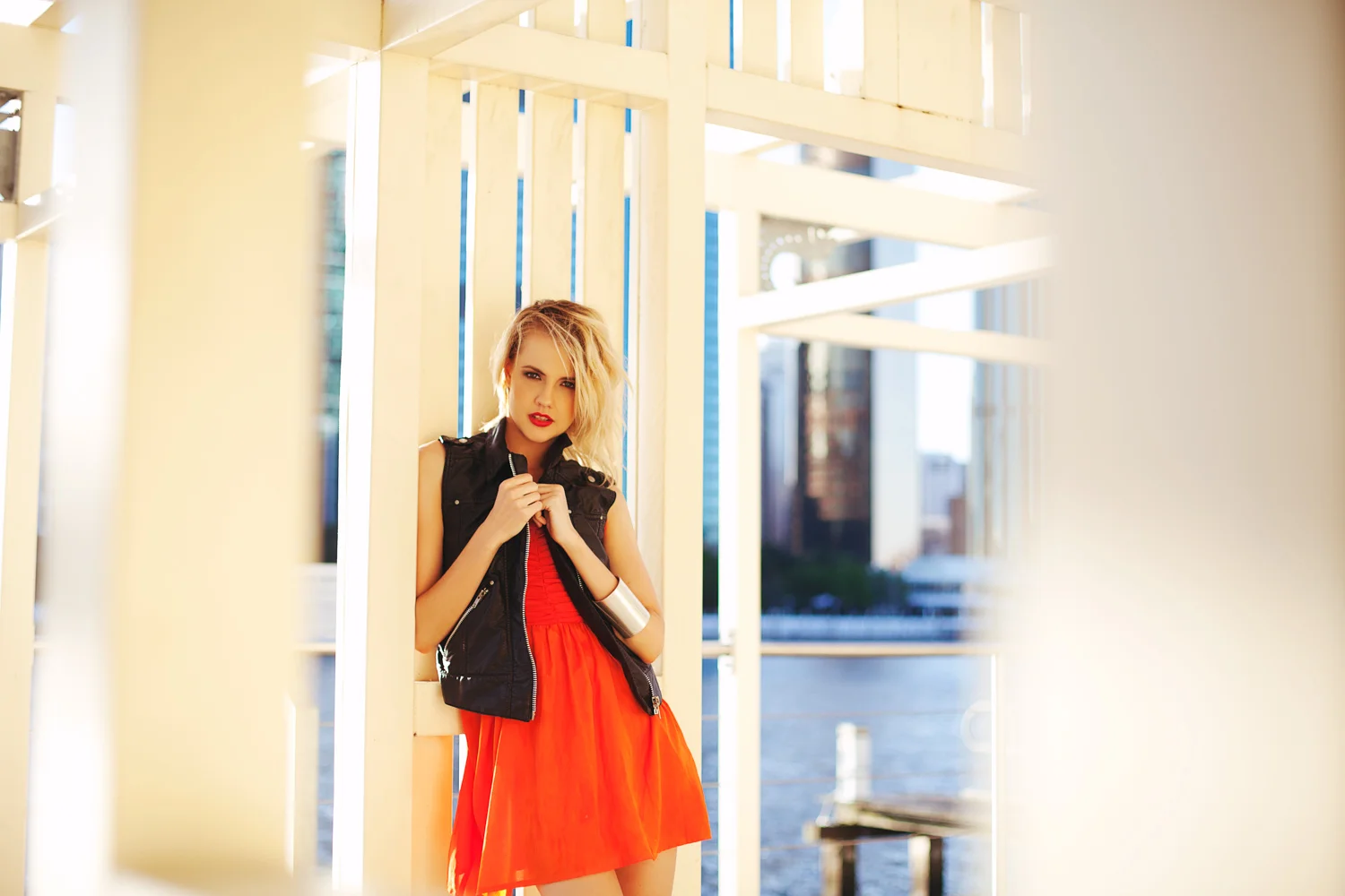 Brisbane, QLD Australia Fashion Photographer Stacey Russell || Fashion Photography Model Photoshoot || blonde girl modelling red dress and black leather jacket in gazebo along city river