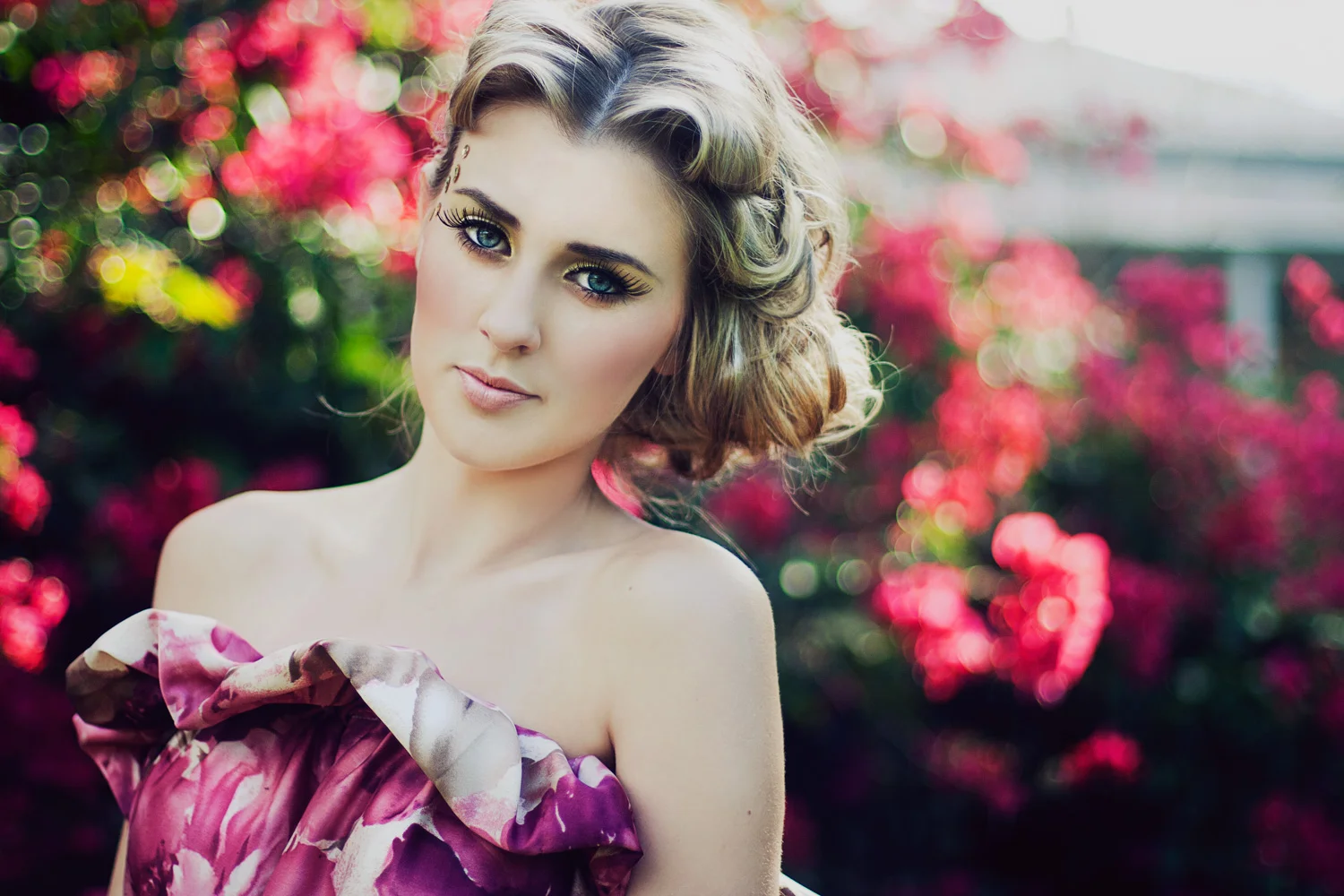 Brisbane, QLD Australia Fashion Photographer Stacey Russell || Fashion Photography Clothing Campaign Photoshoot || girl modelling wearing pink floral dress, blonde hair up, pink and green background