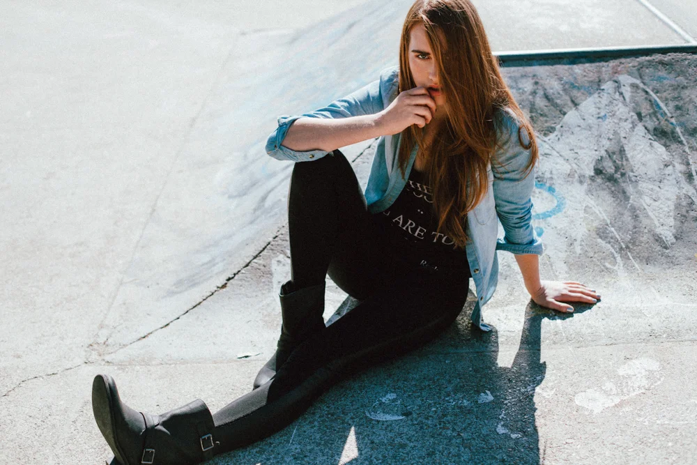 Brisbane Australia Fashion Photographer Stacey Russell || Professional Photography Modelling Photoshoot || Model portfolio image of girl wearing black leggings denim jacket sitting in skate par (Copy)