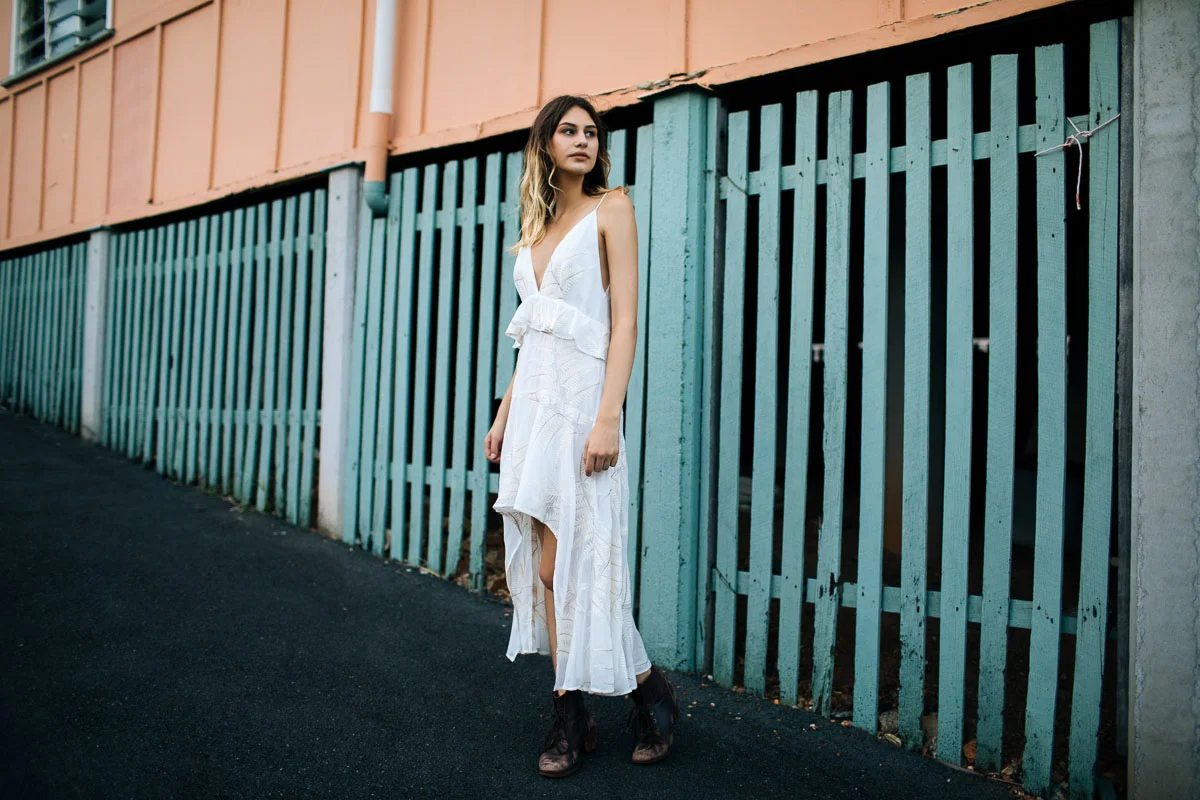 Brisbane Model Photographer Stacey Russell || Professional Australia Fashion Photography Modelling Photoshoot || Model portfolio image of girl in white dress near pastel green fencing (Copy)