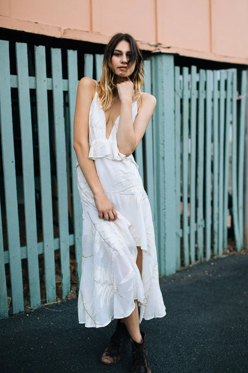 Brisbane Model Photographer Stacey Russell || Professional Australia Fashion Photography Modelling Photoshoot || Model portfolio image of girl in white dress near pastel green fencing (Copy)