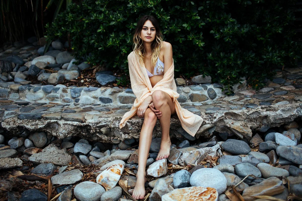 Brisbane Model Photographer Stacey Russell || Professional Australia Fashion Photography Modelling Photoshoot || Model portfolio image of girl sitting on rock path with orange coat (Copy)