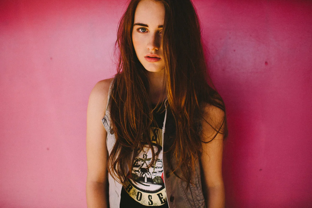 Brisbane Model Photographer Stacey Russell || Professional Australia Fashion Photography Modelling Photoshoot || Model portfolio image of girl with long brown hair, pink background (Copy)