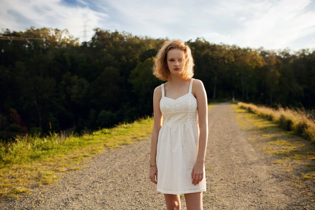 Brisbane Australia Fashion Photographer Stacey Russell || Fashion Photography Modelling Photoshoot || Model portfolio image of blonde girl wearing white dress on dirt road