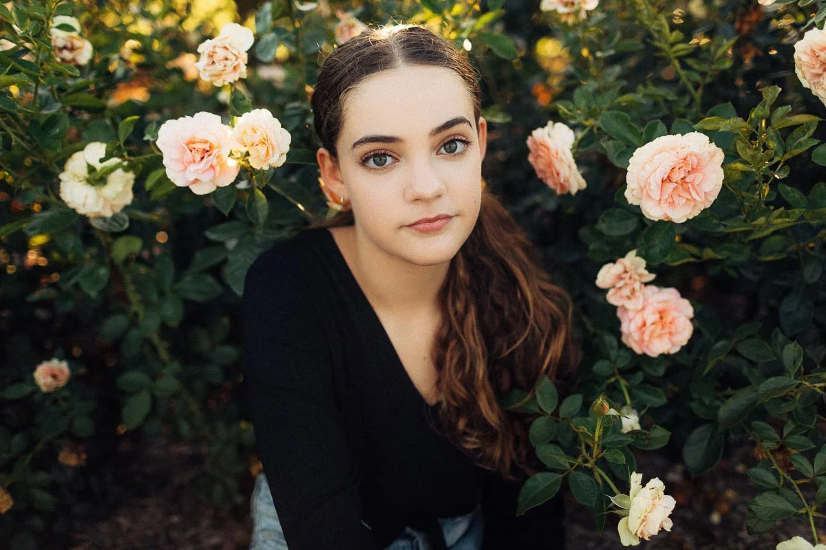 Brisbane Model Photographer Stacey Russell || Professional Australia Fashion Photography Modelling Photoshoot || Beautiful model portfolio image of girl sitting amongst pink roses  (Copy)