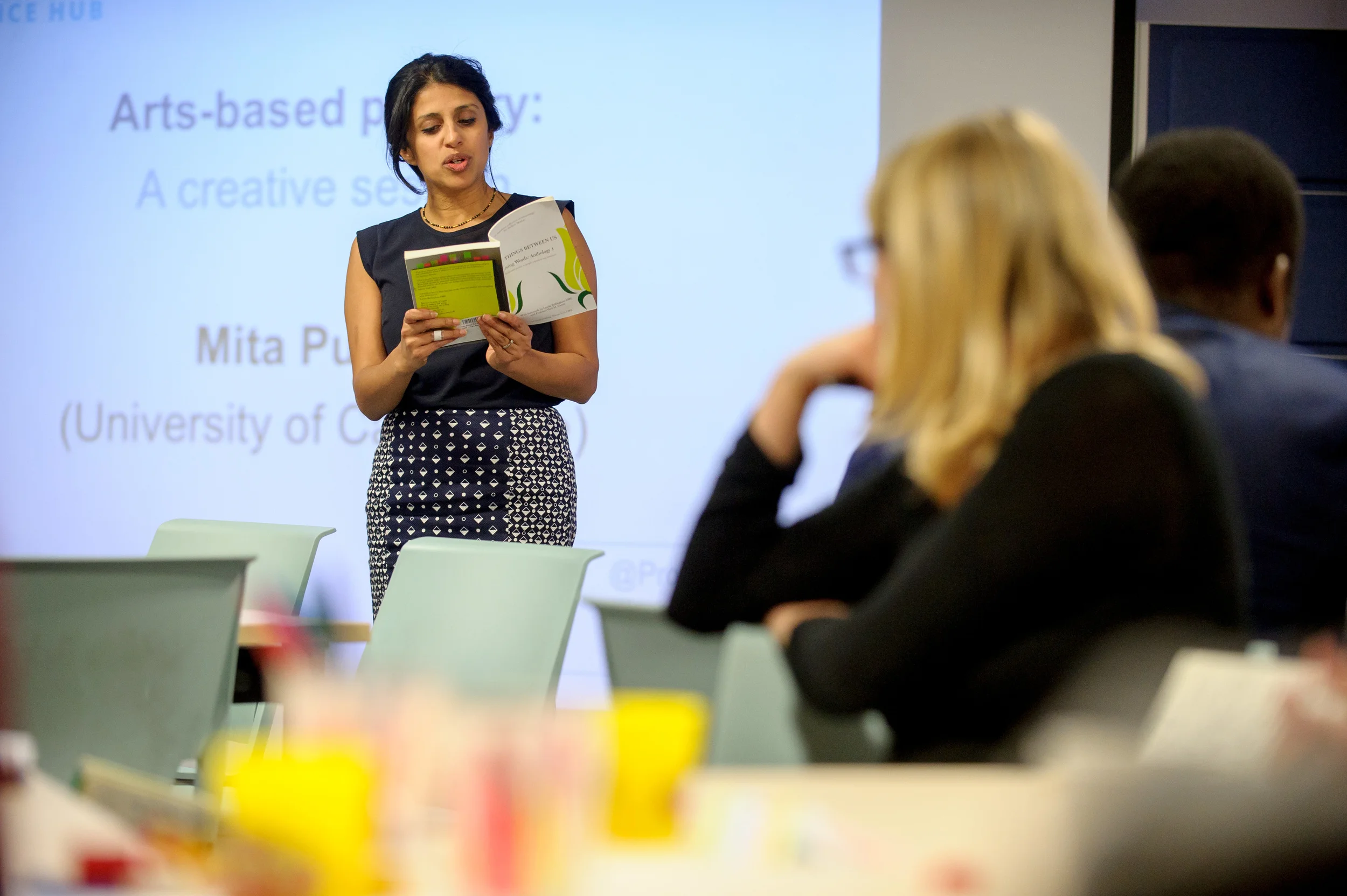 Mita opening the plenary with a reading from Living Word's book, 'The Things Between Us'