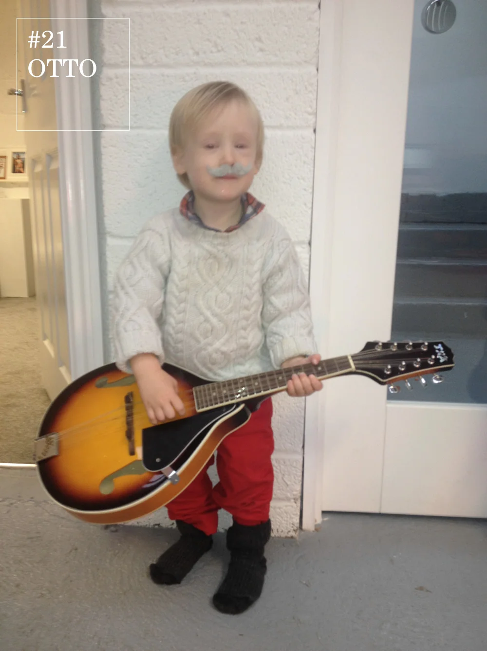 For someone so young, Otto sports a surprising amount of facial hair. He perfectly matches a checkered shirt, chunky knit jumper and red trousers for an on trend folk look.
A musical connoisseur, he tops this outfit with a mandolin, where he got it no one knows but he sure can play a good cover of REM-Losing My Religion with it.
Otto proves you’re never too young to own a unique sense of style or support a good cause.