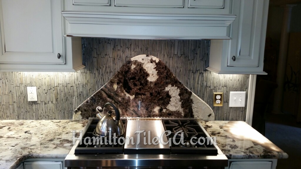A 100lb piece of granite set into the wall behind this stove. Quite a project, and Kerdi board was expertly utilized once again.